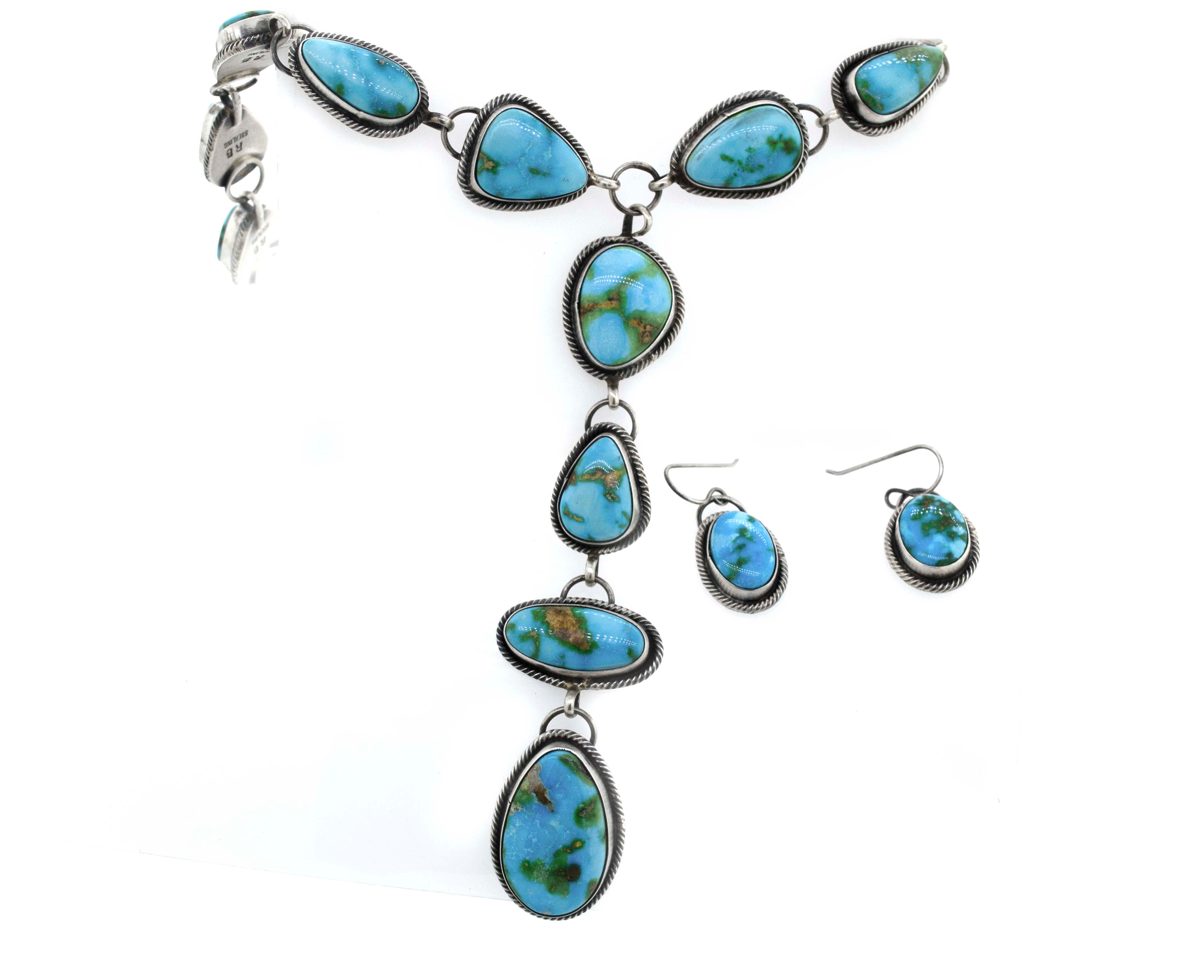 A Stunning Sonora Gold Lariat Necklace And Earrings Set by Super Silver with a handmade textured rope design.