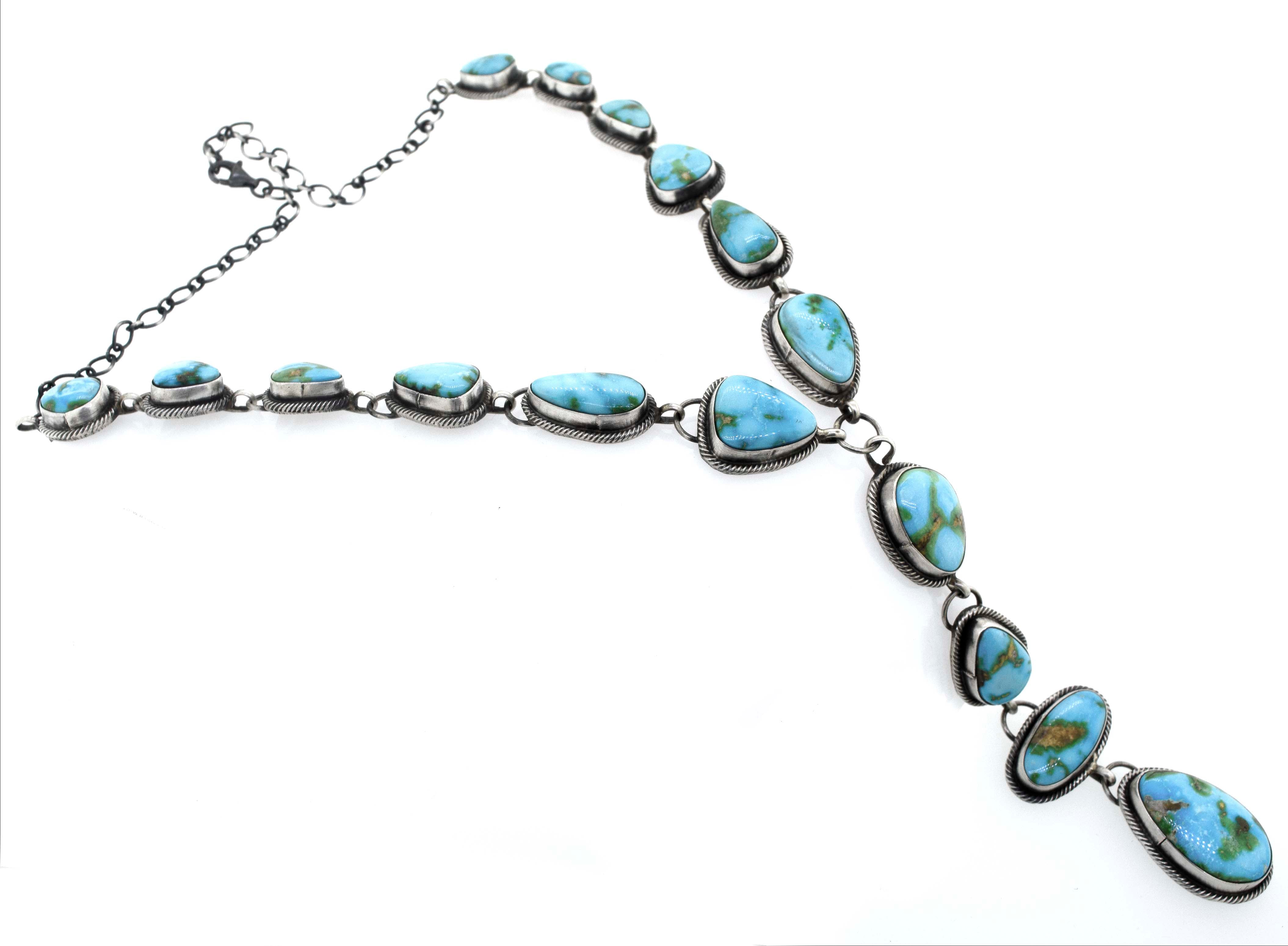 A Stunning Sonora Gold Lariat Necklace And Earrings Set by Super Silver, with Sonora gold turquoise stones on it, featuring a handmade textured rope design.