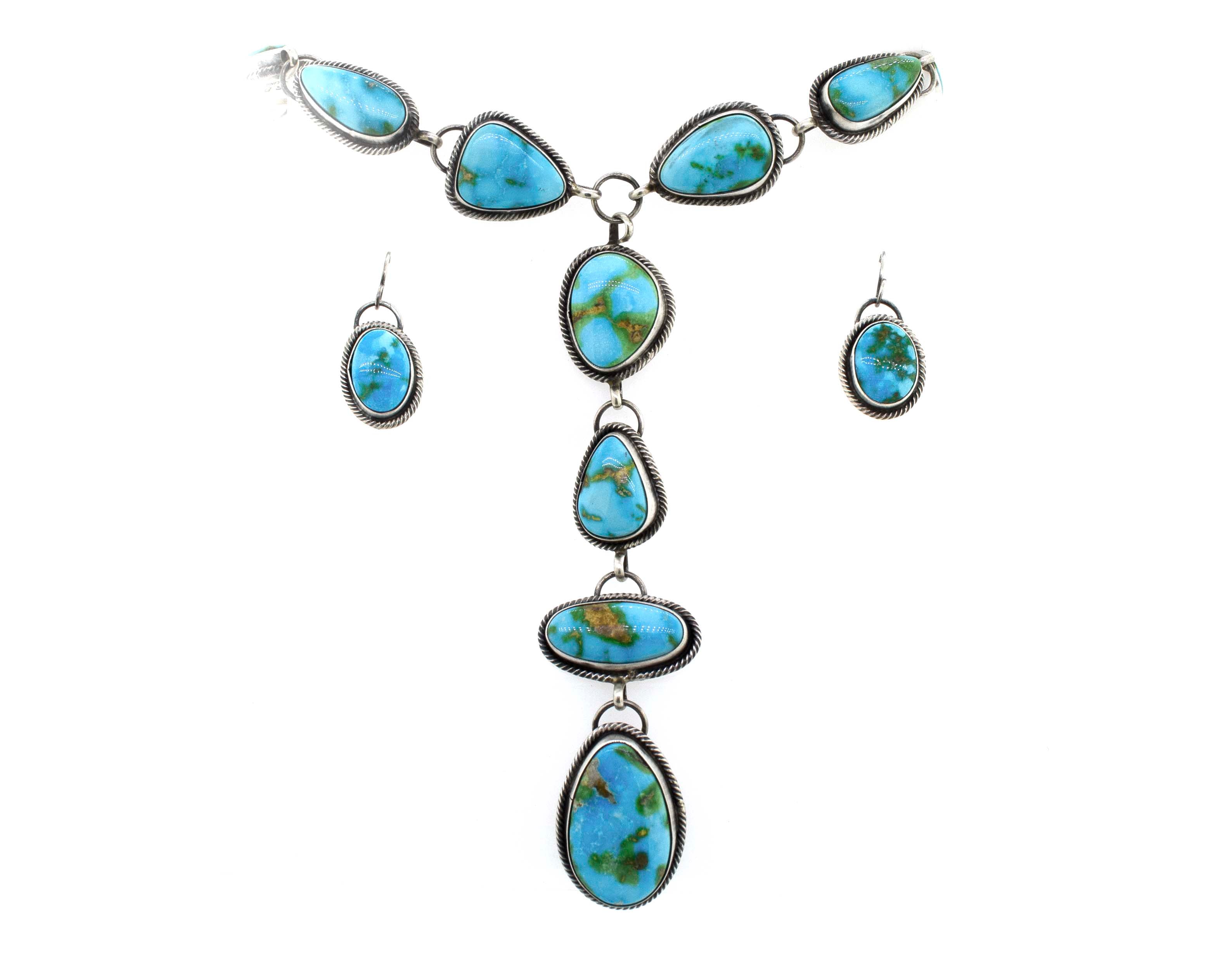 A Stunning Sonora Gold Lariat Necklace And Earrings Set featuring Sonora gold turquoise stones in a textured rope design by Super Silver.