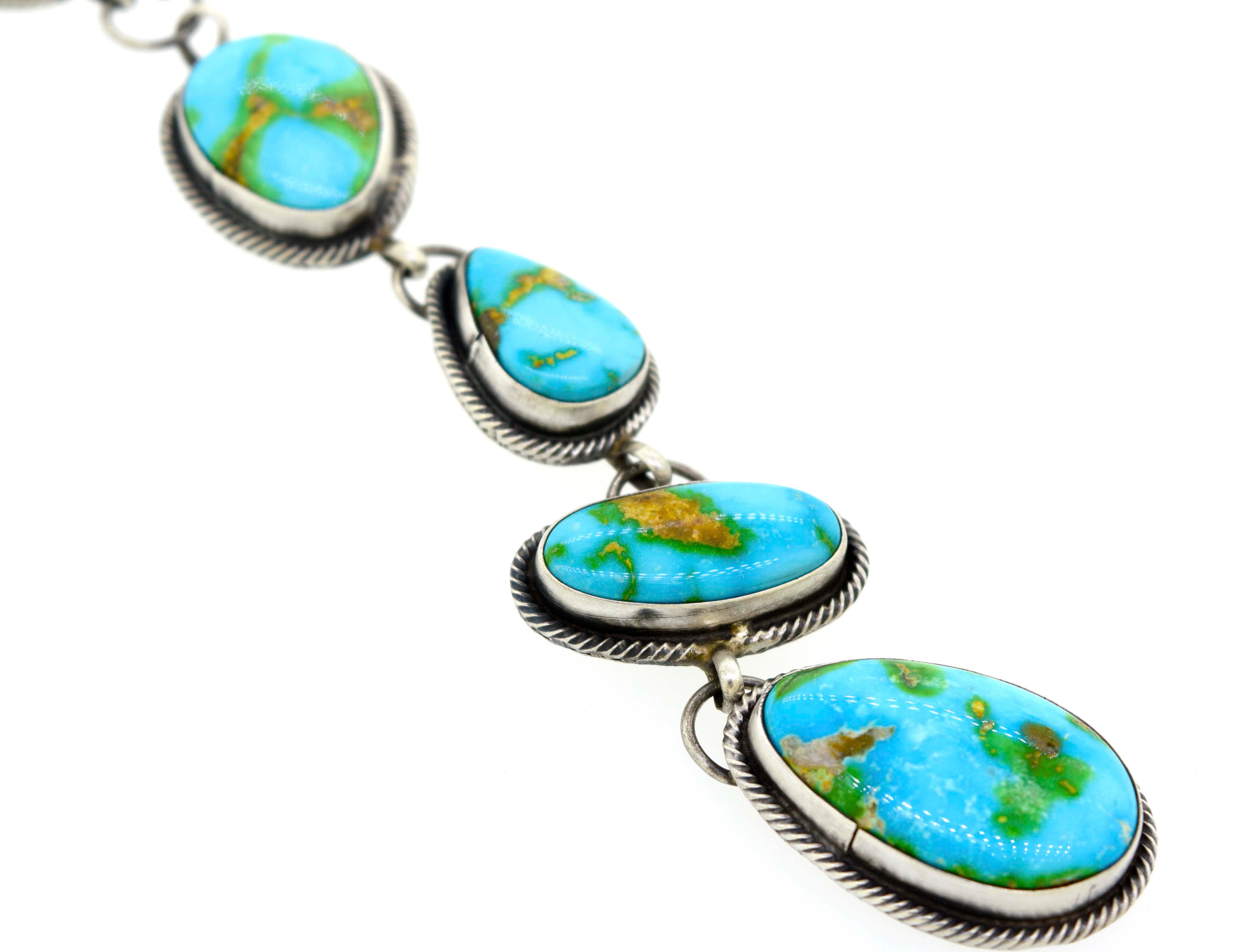 A Stunning Sonora Gold Lariat Necklace And Earrings Set by Super Silver, with Sonora gold turquoise stones on it, featuring a textured rope design.