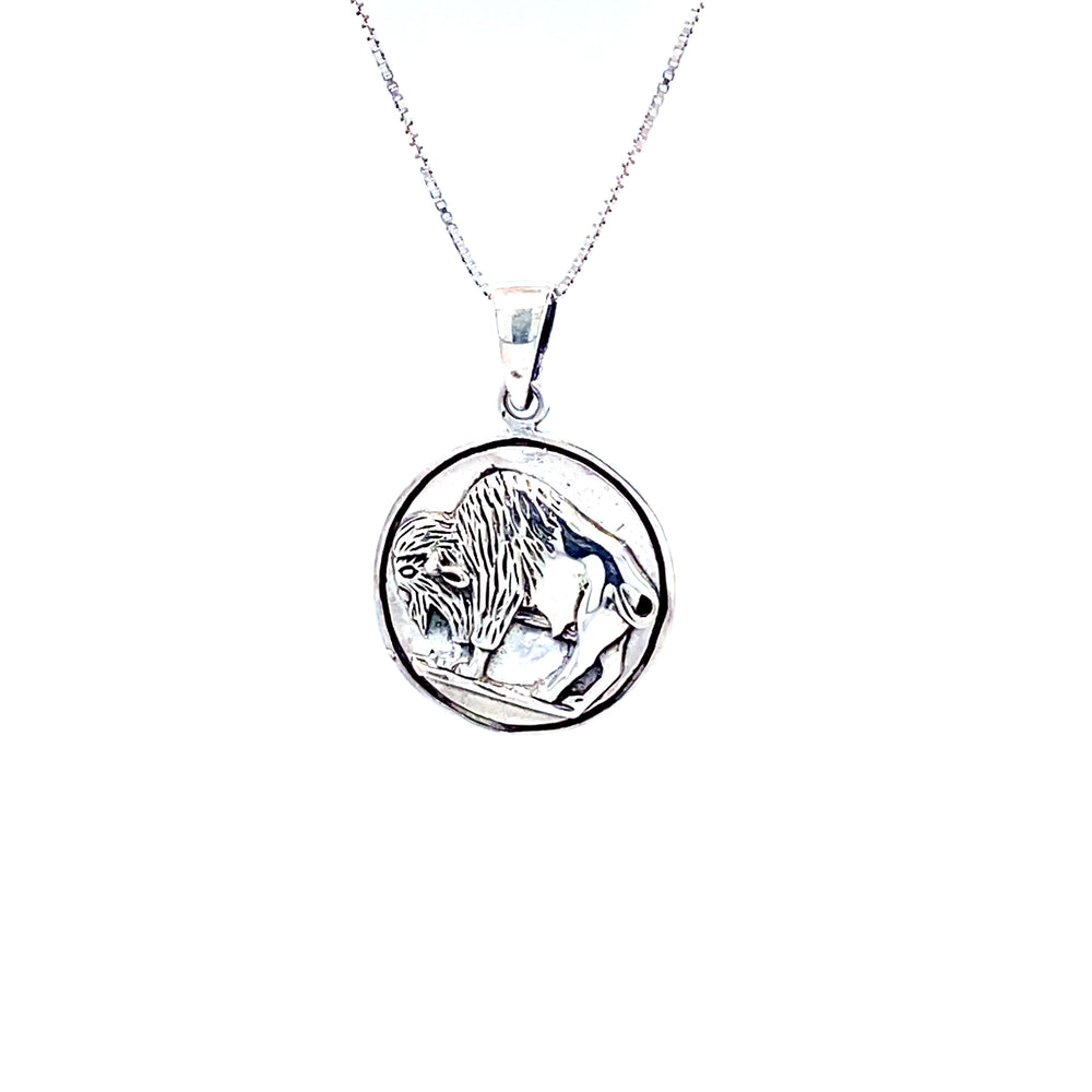 A Super Silver Buffalo Coin Charm necklace with a lion on it.