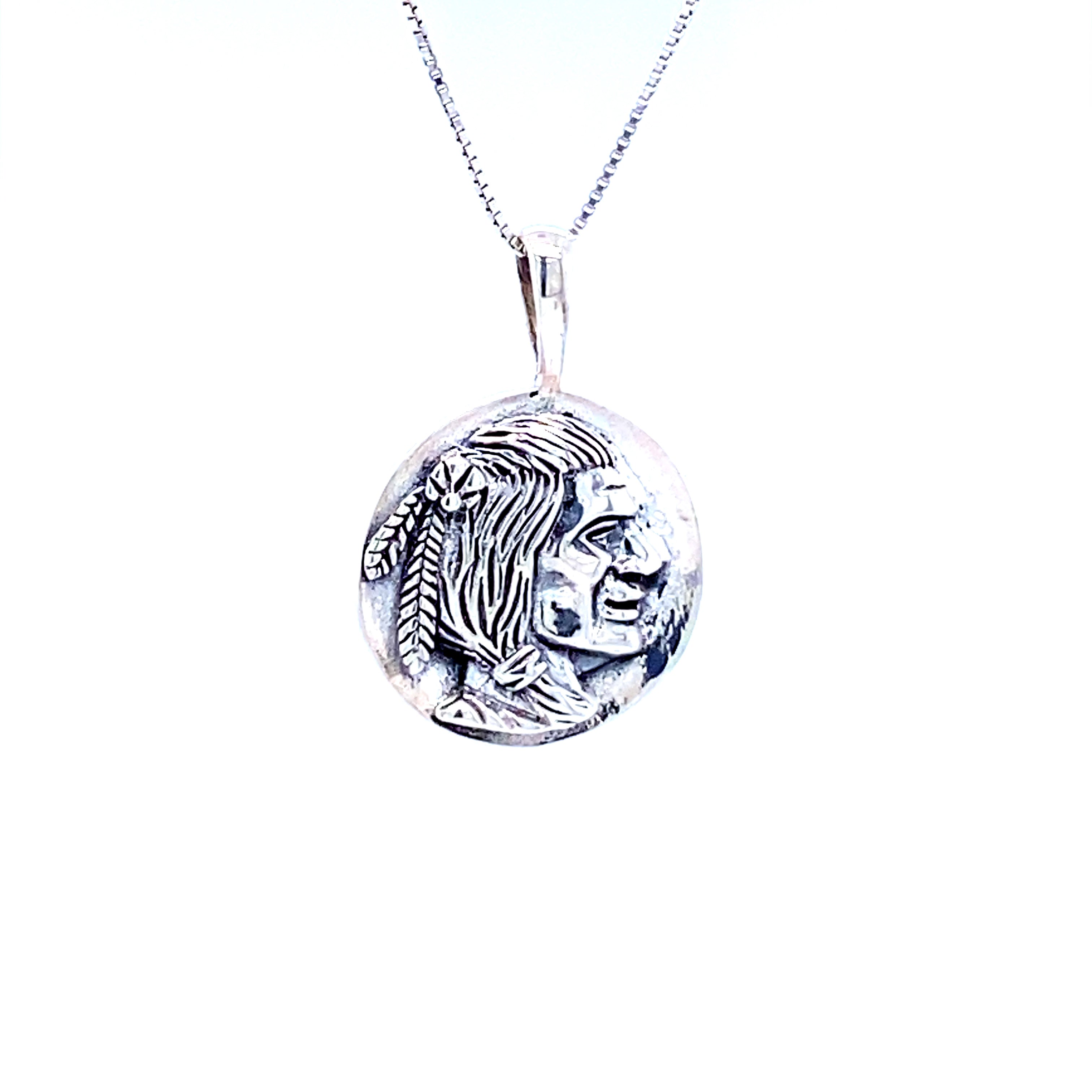 A Super Silver Native Head Coin Charm pendant.