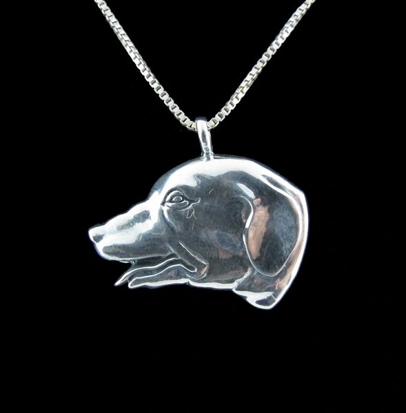 A Super Silver Dog Head Pendant for dog lovers featuring a dog's head.