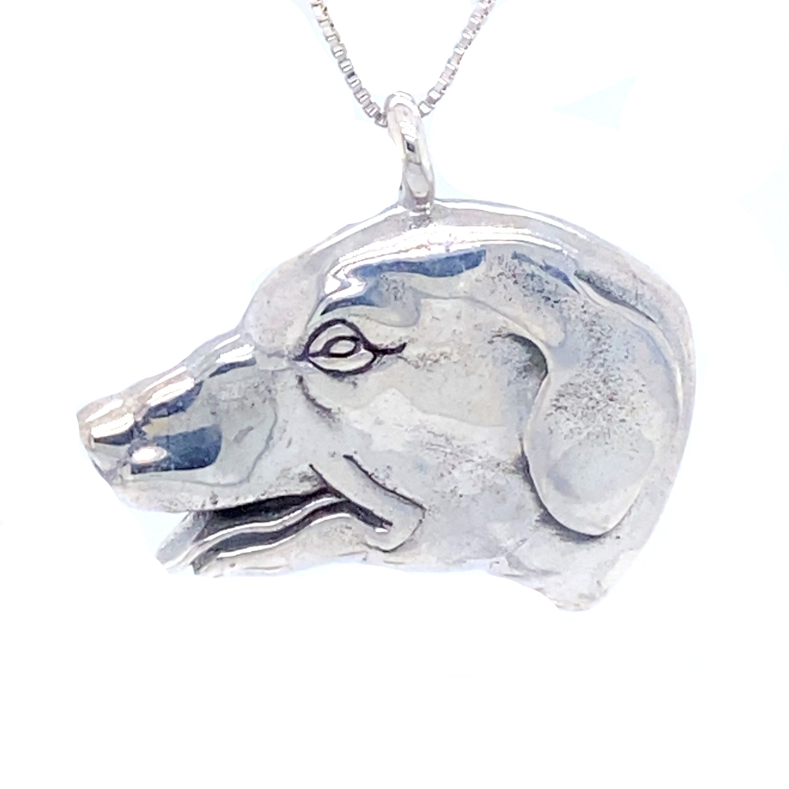 A Super Silver Dog Head Pendant on a chain, perfect for any dog lover.