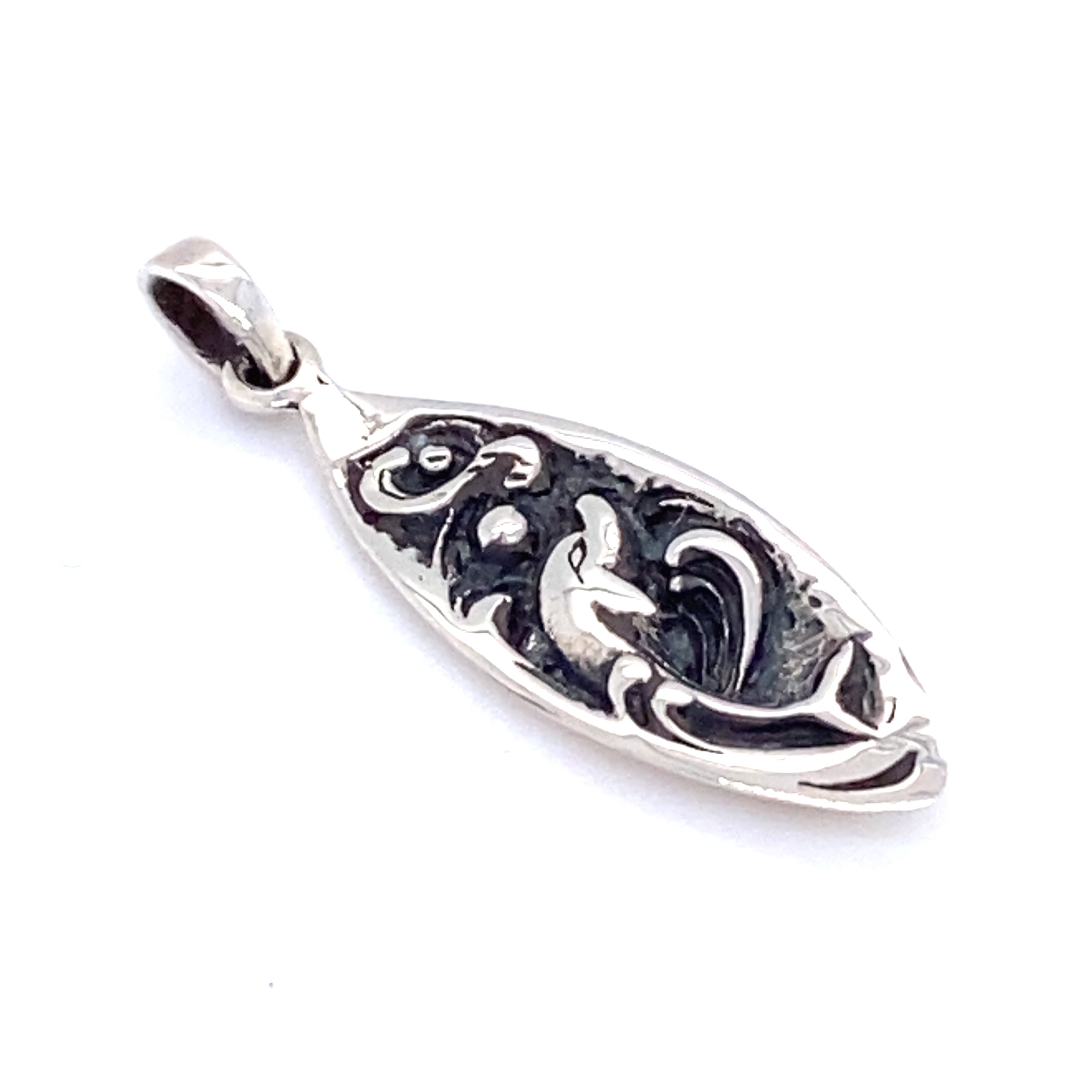 A Dolphin Surfboard Pendant by Super Silver with an ornate Santa Cruz design.