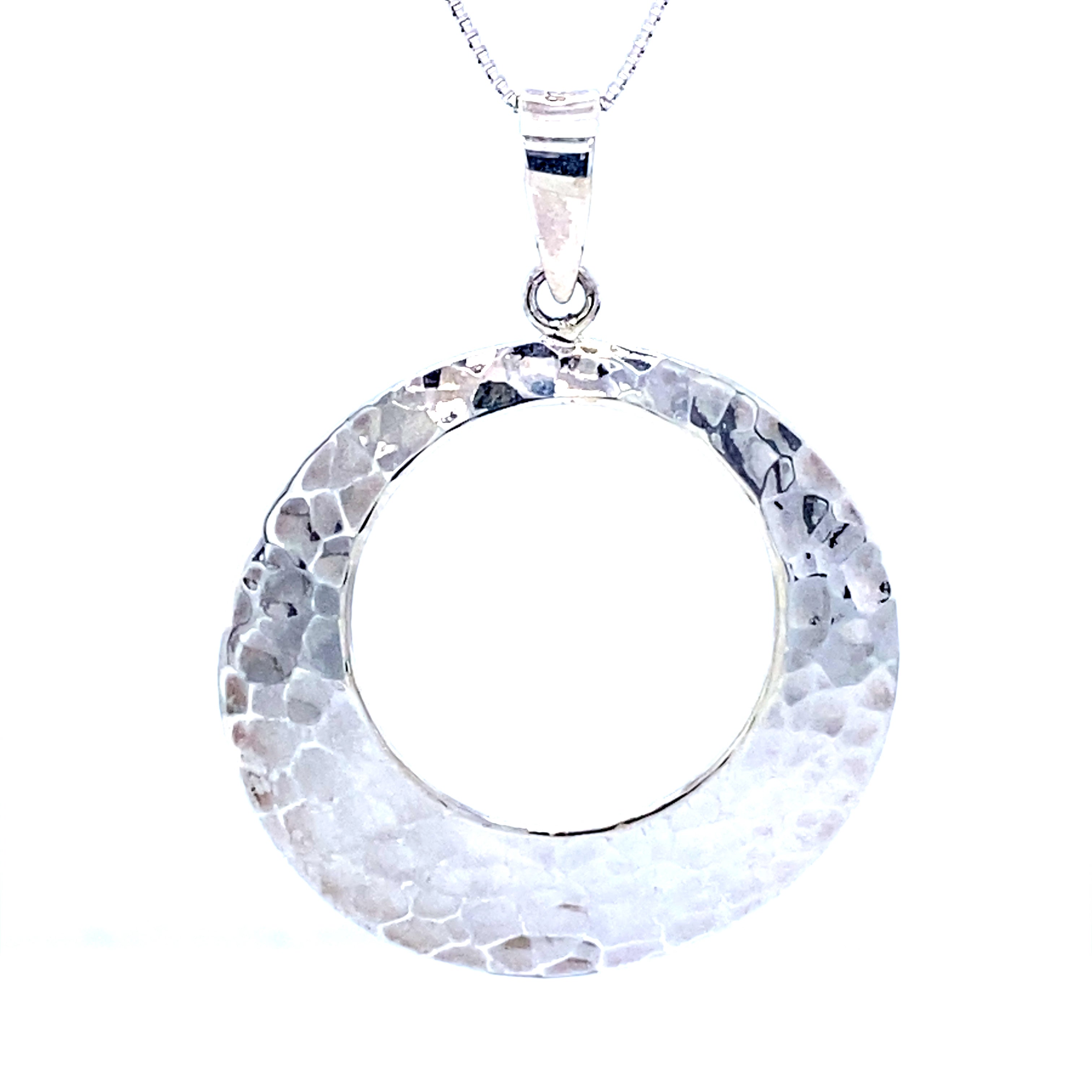 This sleek and modern Super Silver hammered round pendant is crafted in sterling silver.