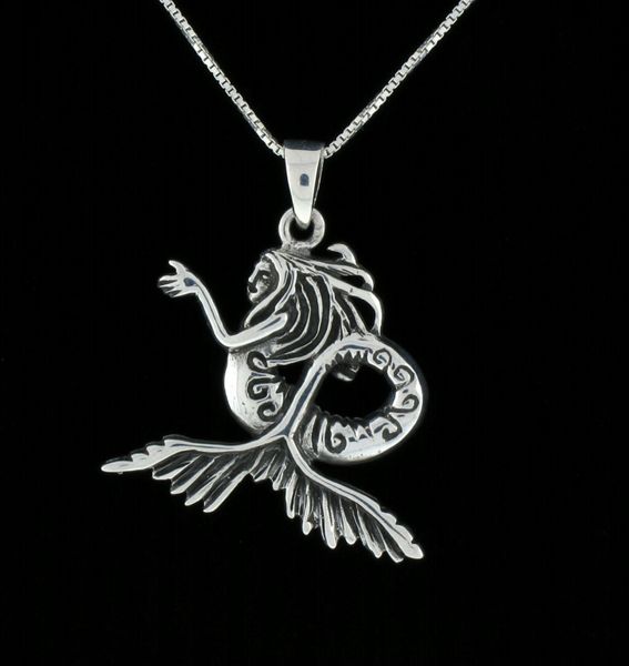 A seductive Silver Siren Pendant by Super Silver on a blue sea background.