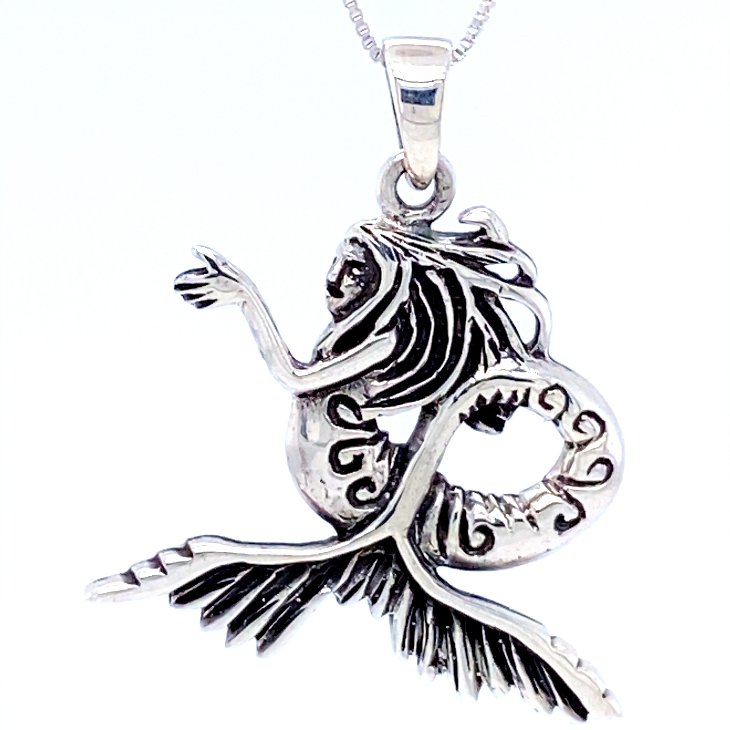 A seductive Super Silver Silver Siren Pendant on a chain, reminiscent of the ocean's waves.
