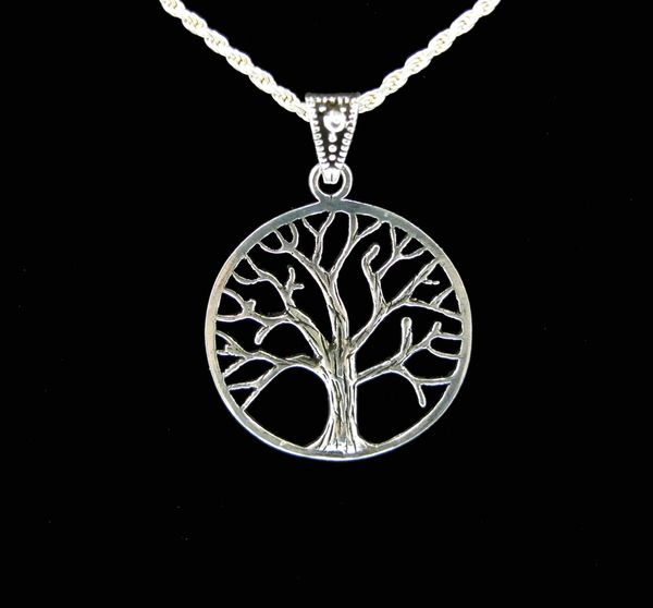 A Super Silver Mother Earth Tree Pendant on a black background.