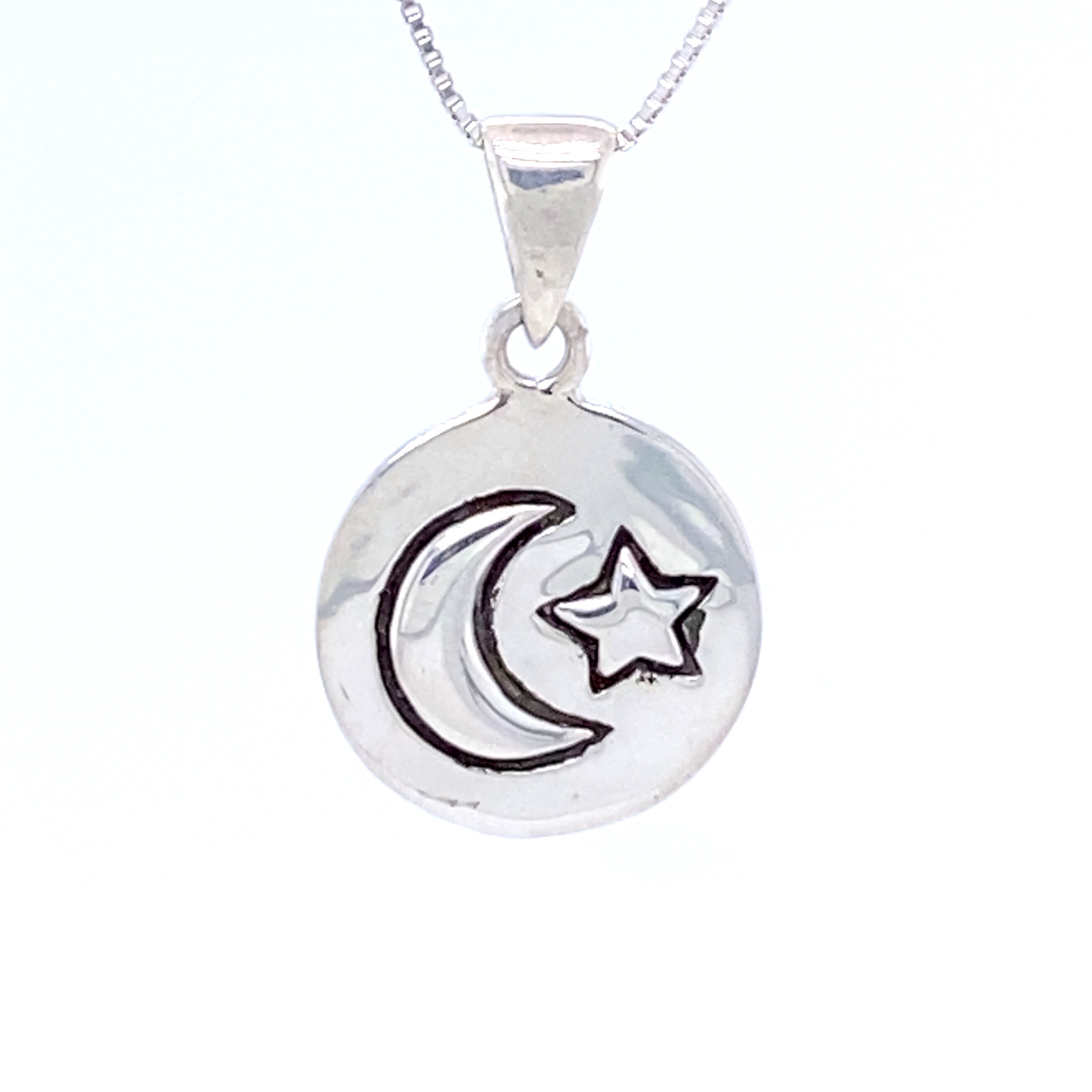 A Super Silver necklace with an oxidized finish and a Moon And Star Pendant featuring a crescent and star.
