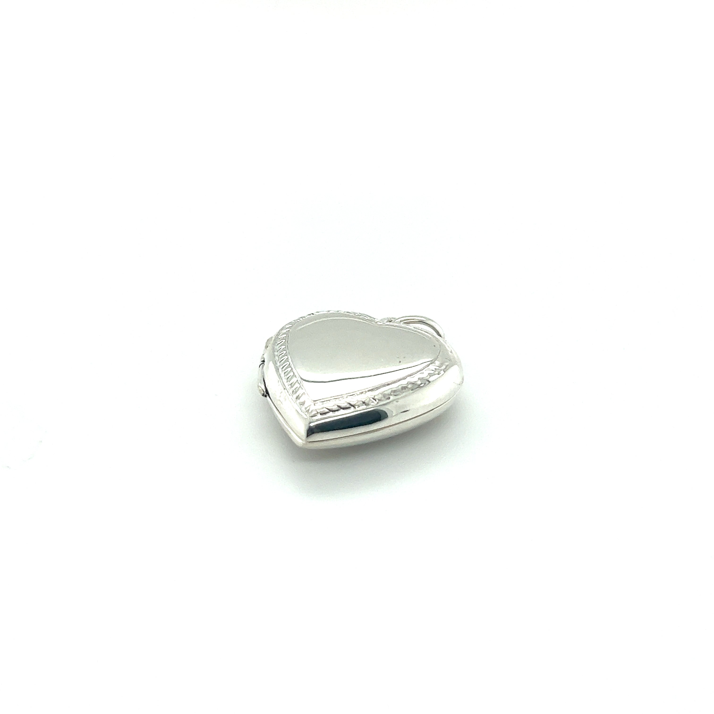 A Super Silver Heart Locket with Delicate Rope Border on a white background.