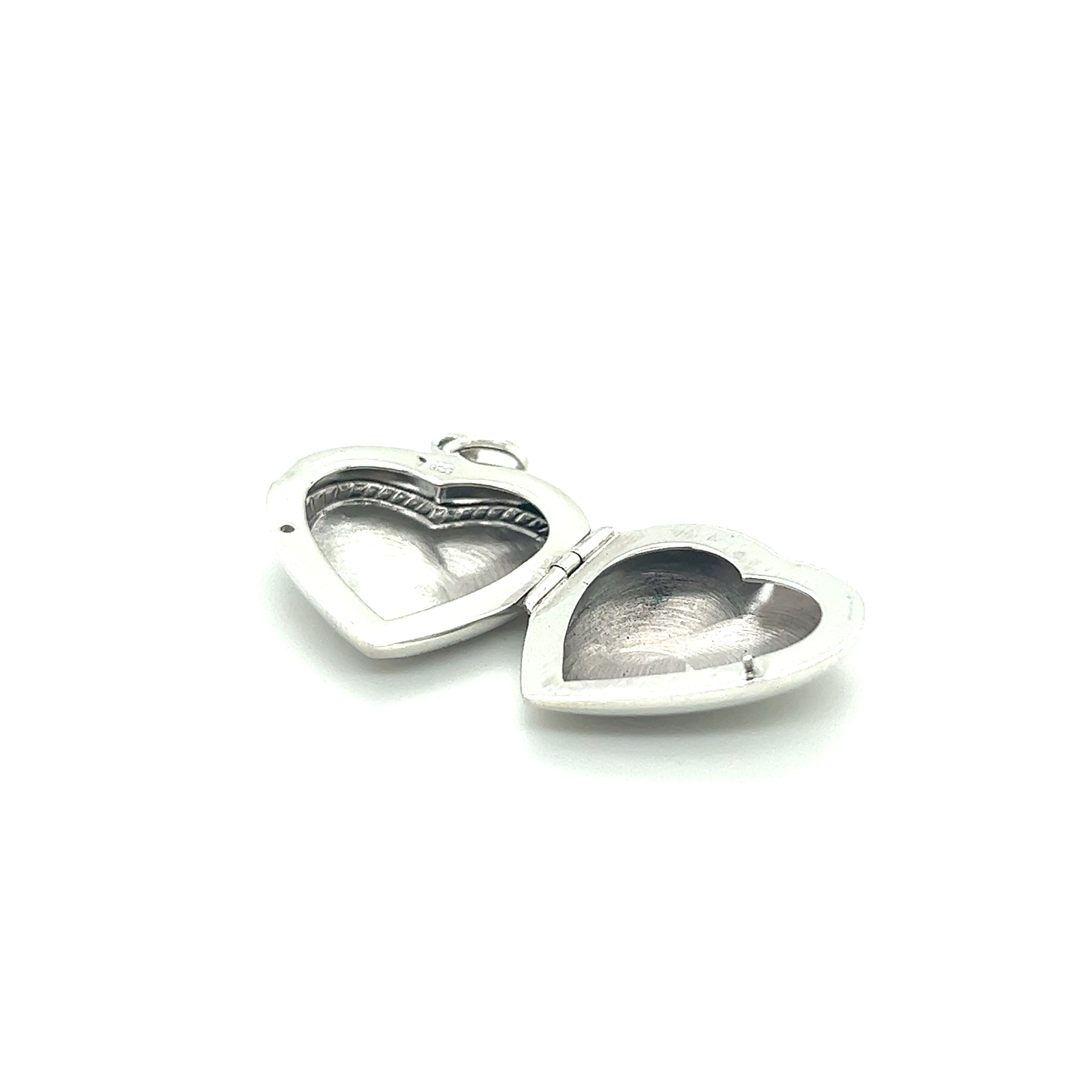 Two Super Silver Heart Lockets with Delicate Rope Border on a white background.