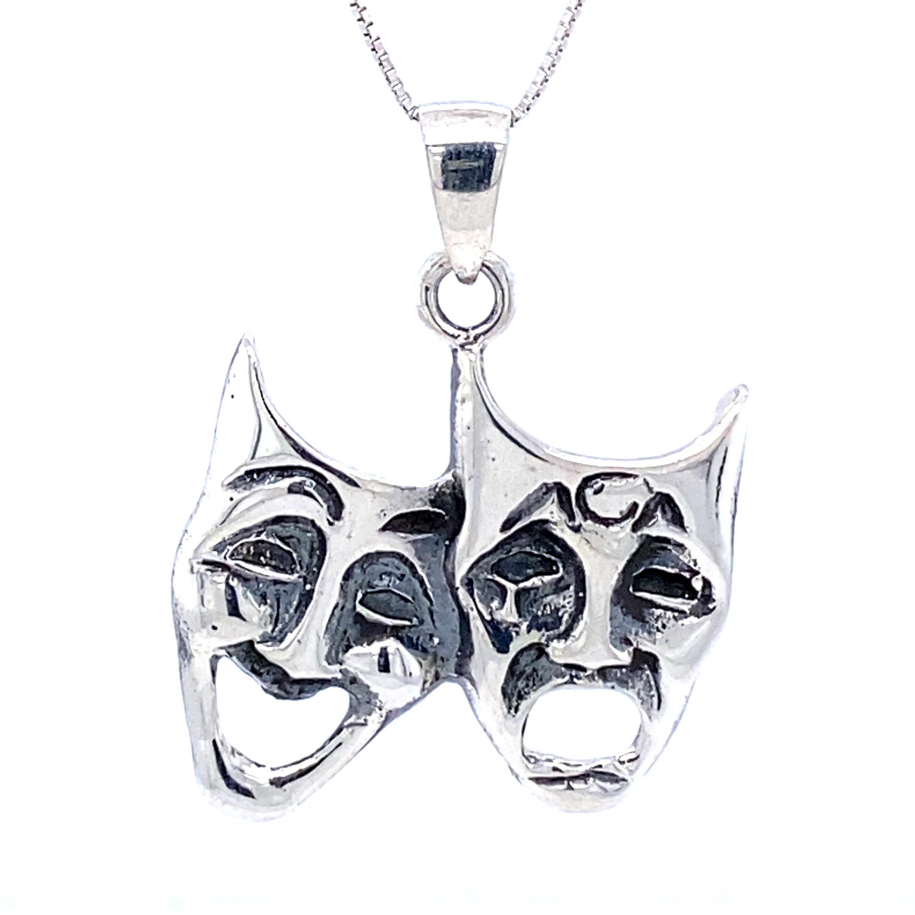 A Laugh Now Cry Later Pendant by Super Silver, featuring two theatre masks.