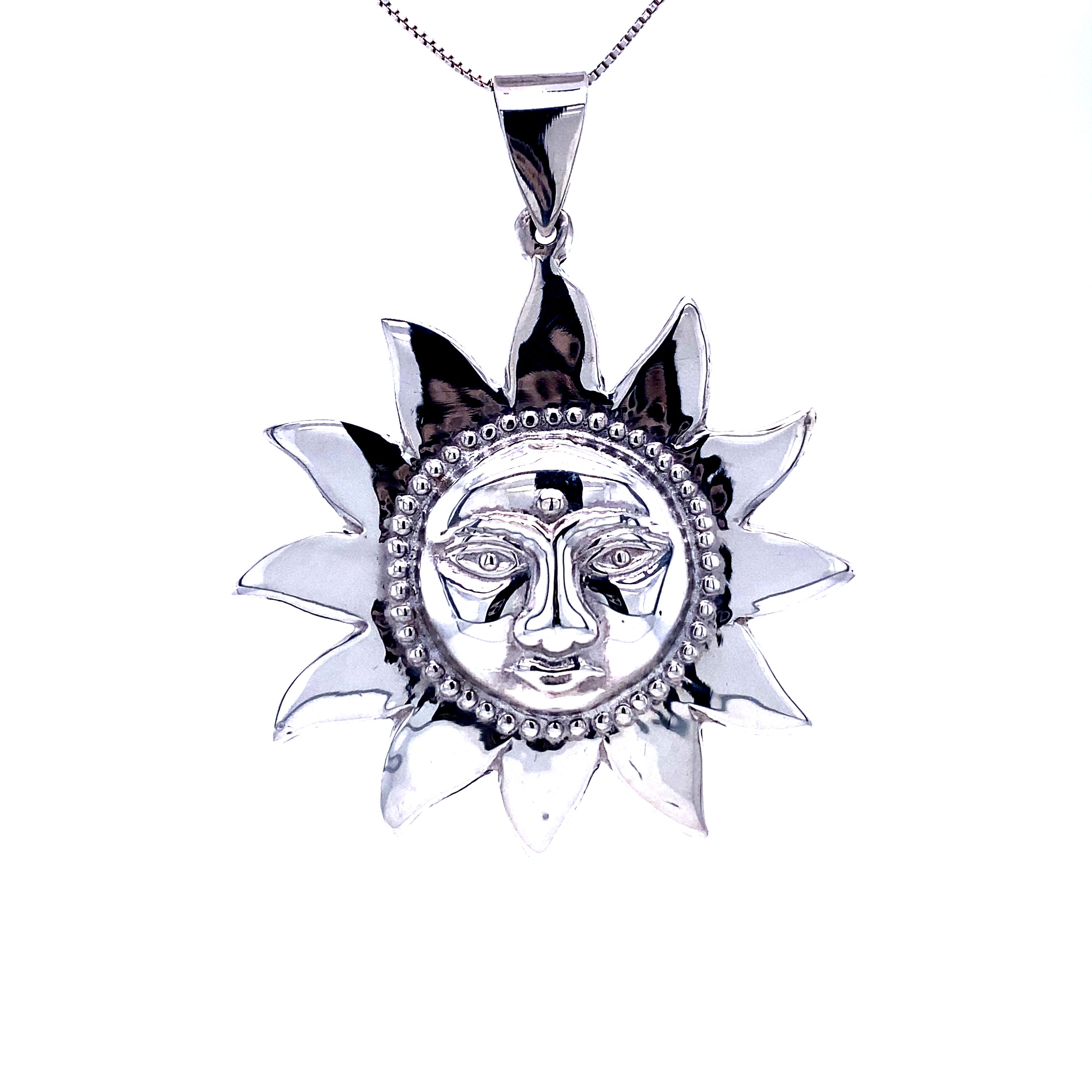 A Super Silver Sun God Pendant featuring the face of a Sun God.