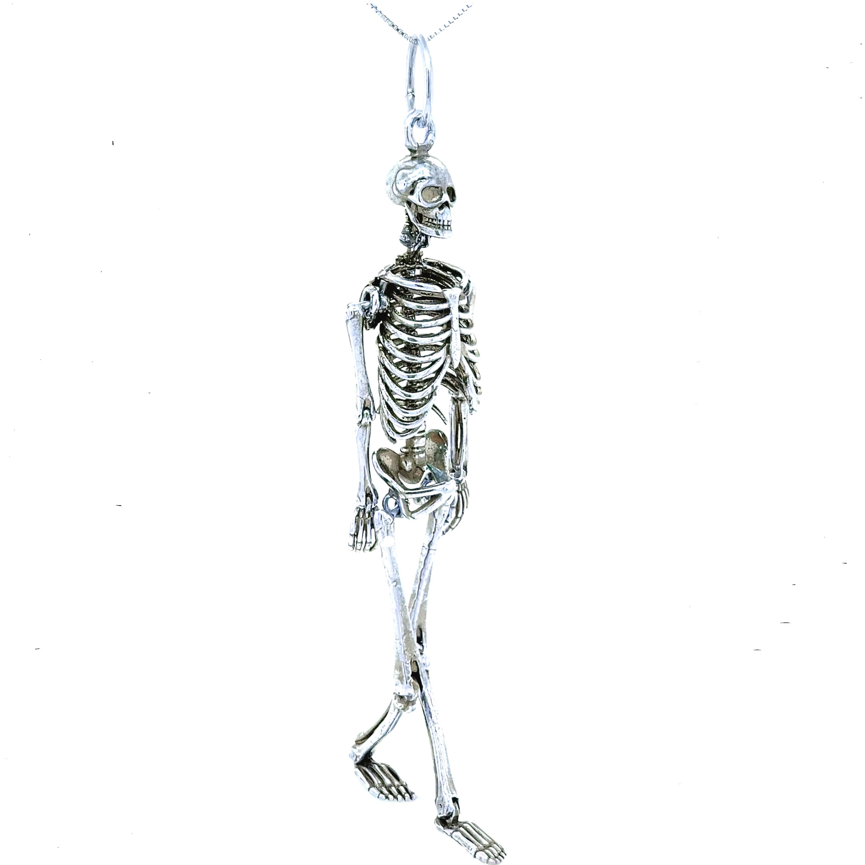 A stylish Large Skeleton Pendant from Super Silver, hanging from a chain, creating a unique statement piece.