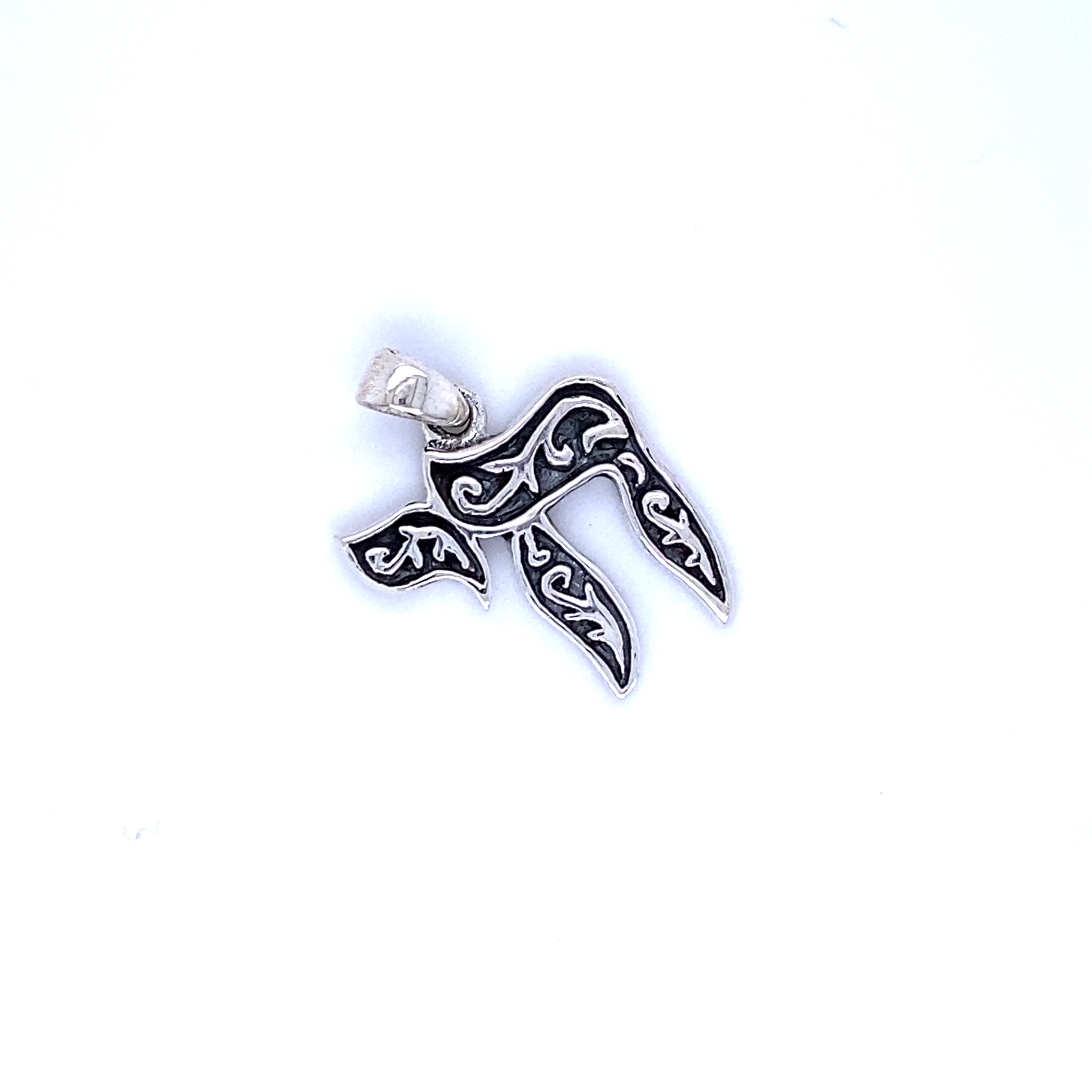 A Super Silver Chai Symbol Pendant with Filigree Design, representing Jewish heritage.
