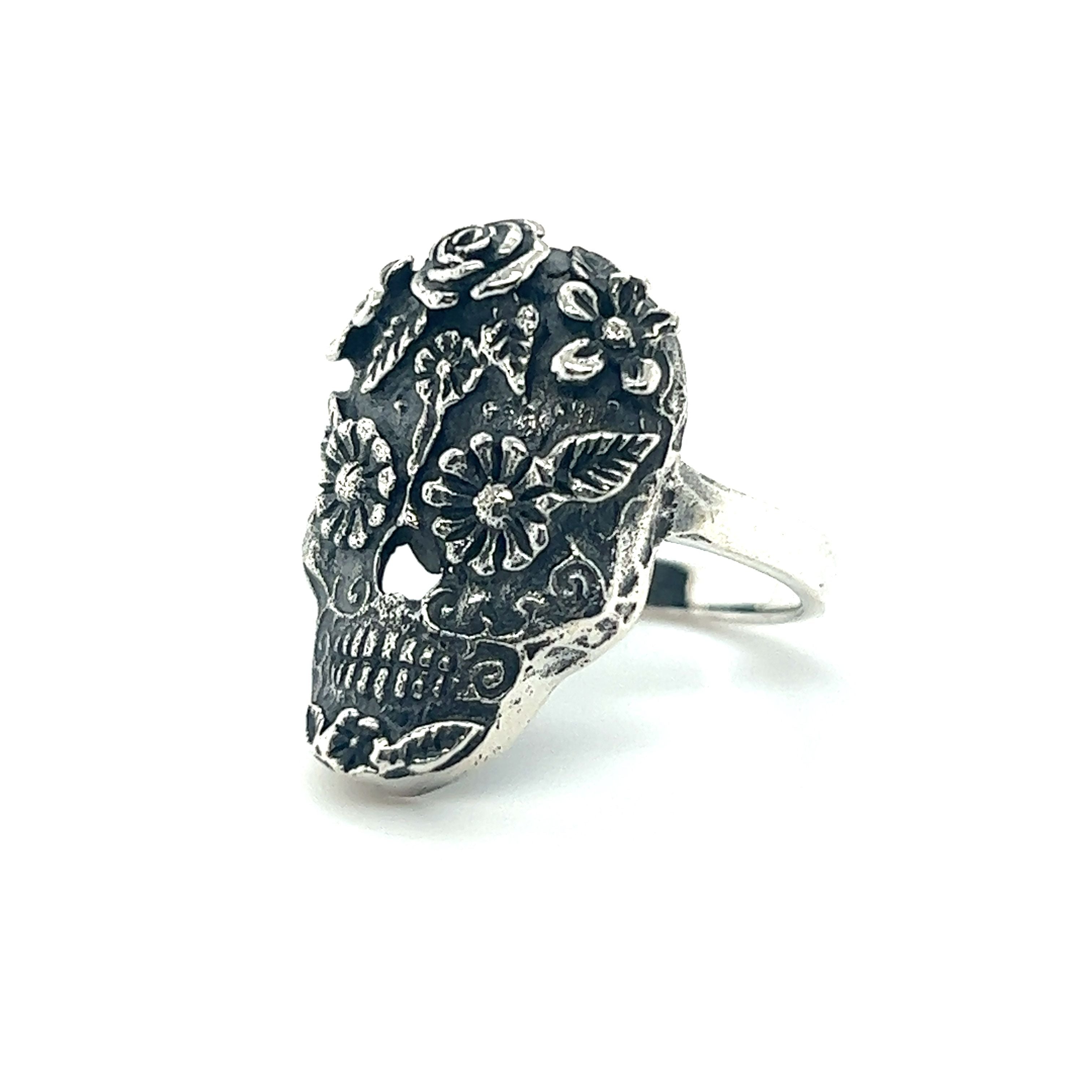 A cultural Intricate Sugar Skull ring on a white background.