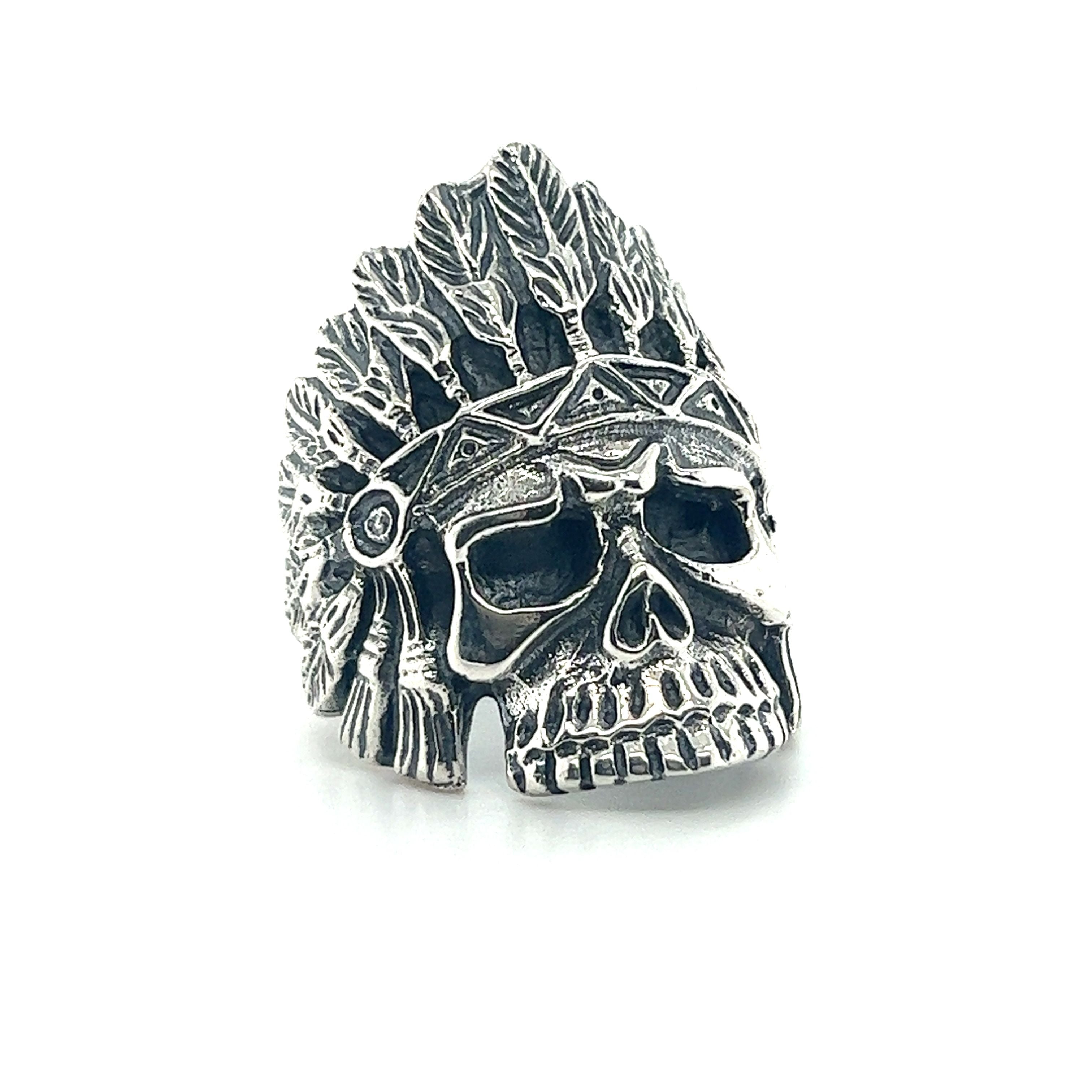 A native-inspired Chief Skull ring with stone inlay and feathers.