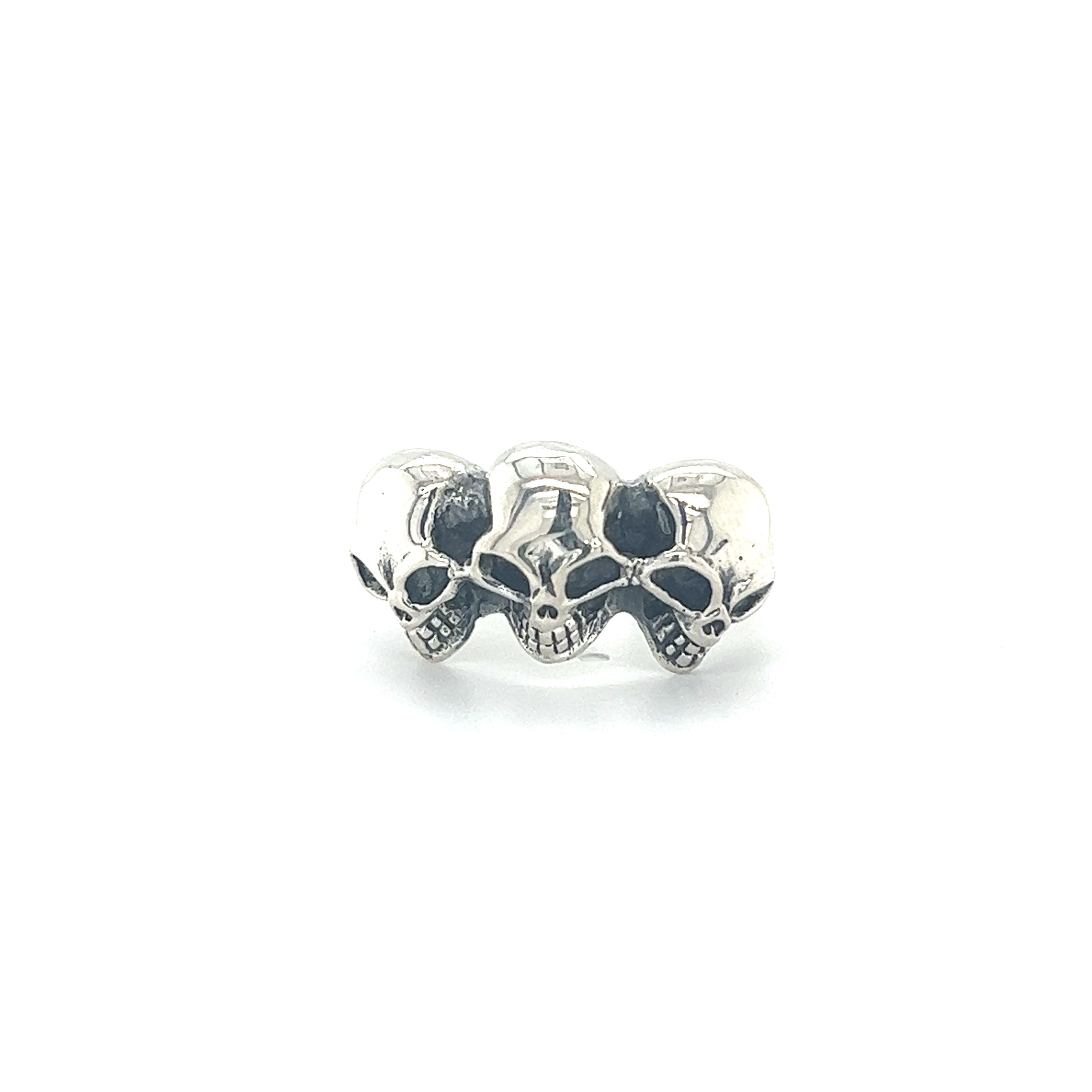 A Heavy Triple Skull Ring adorned with three intricate skulls, perfect for men seeking bold and edgy accessories.