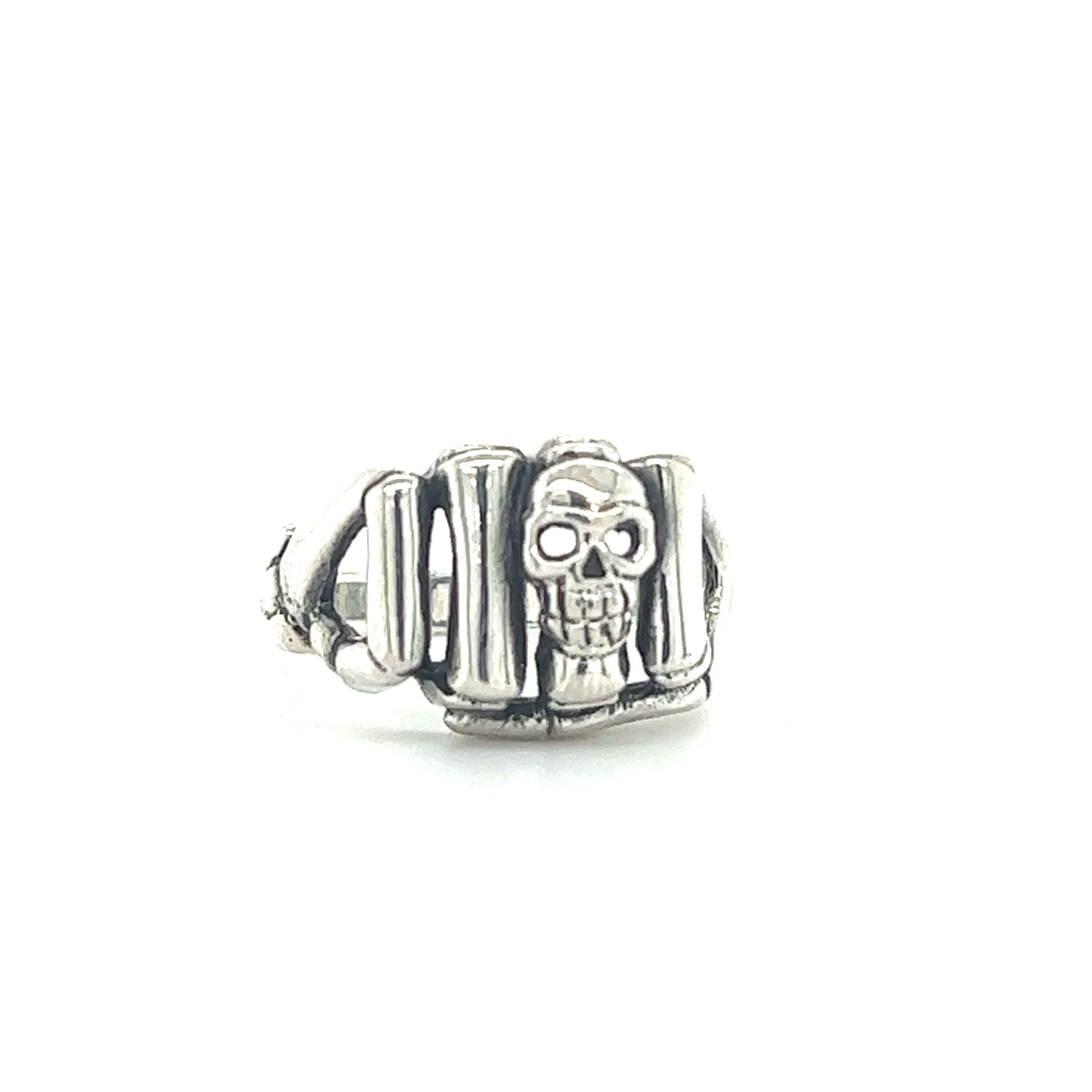 A sterling silver men's Skeleton Fist Ring With Small Skull.
