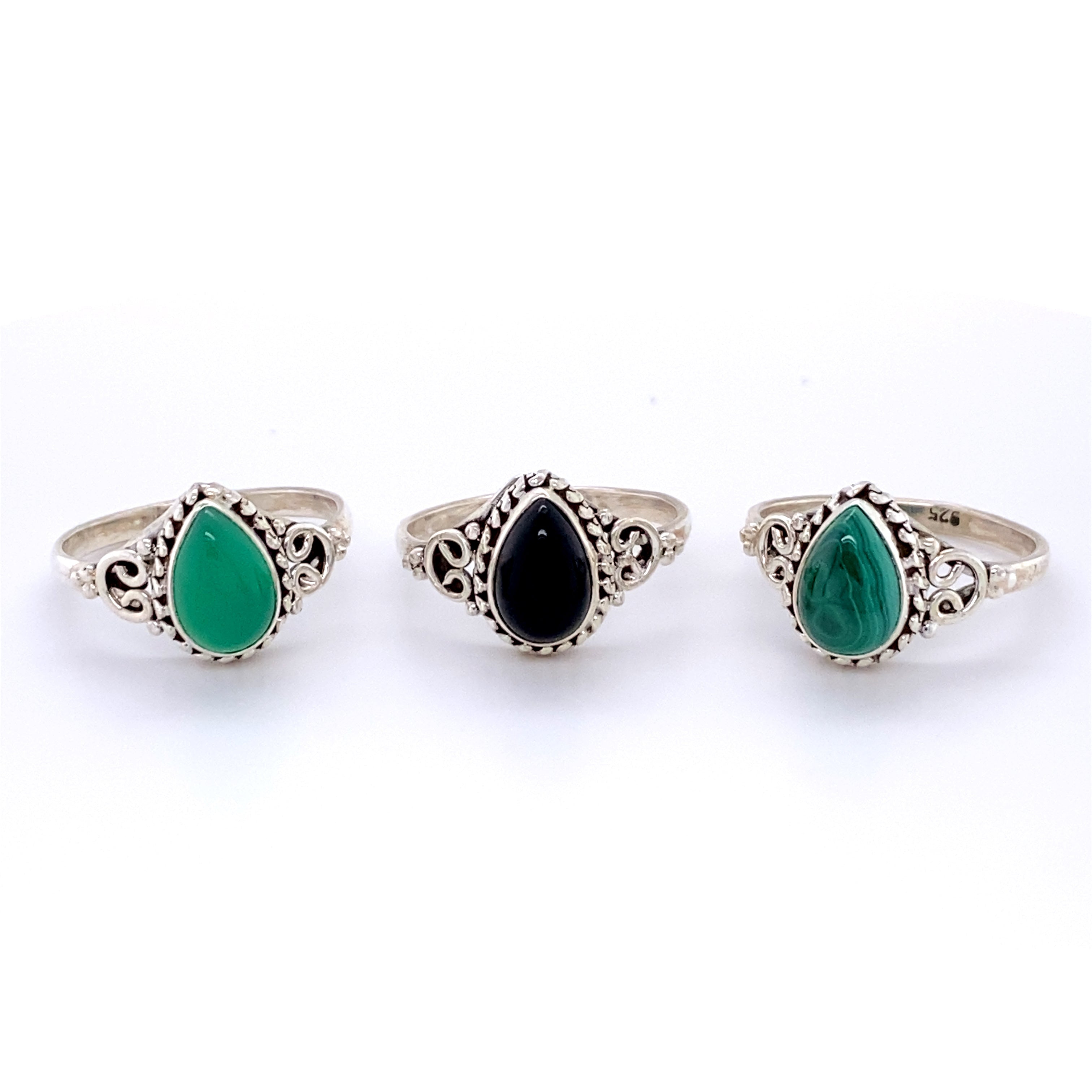 Three Teardrop Gemstone Rings with Intricate Ball Border in a boho style.