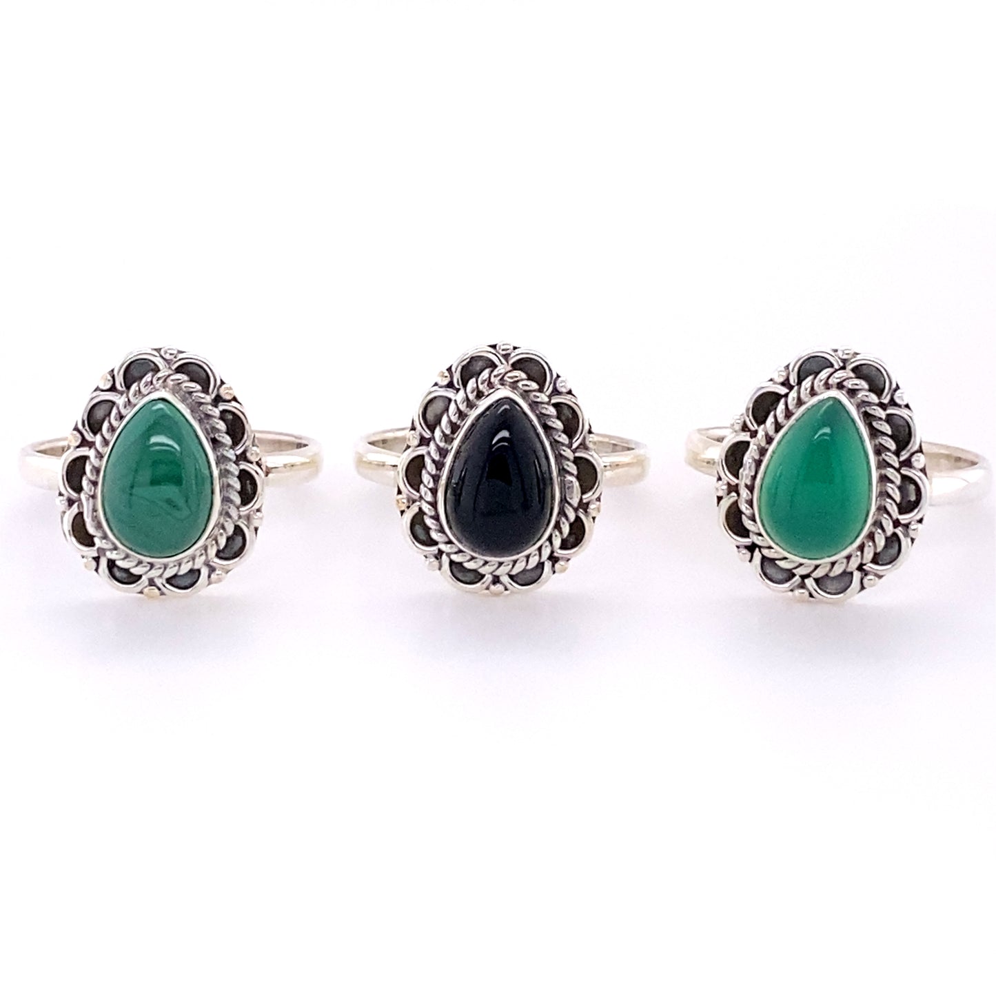 Three Teardrop Gemstone Rings with Flower Filigree Border, perfect for a boho or hippie style.