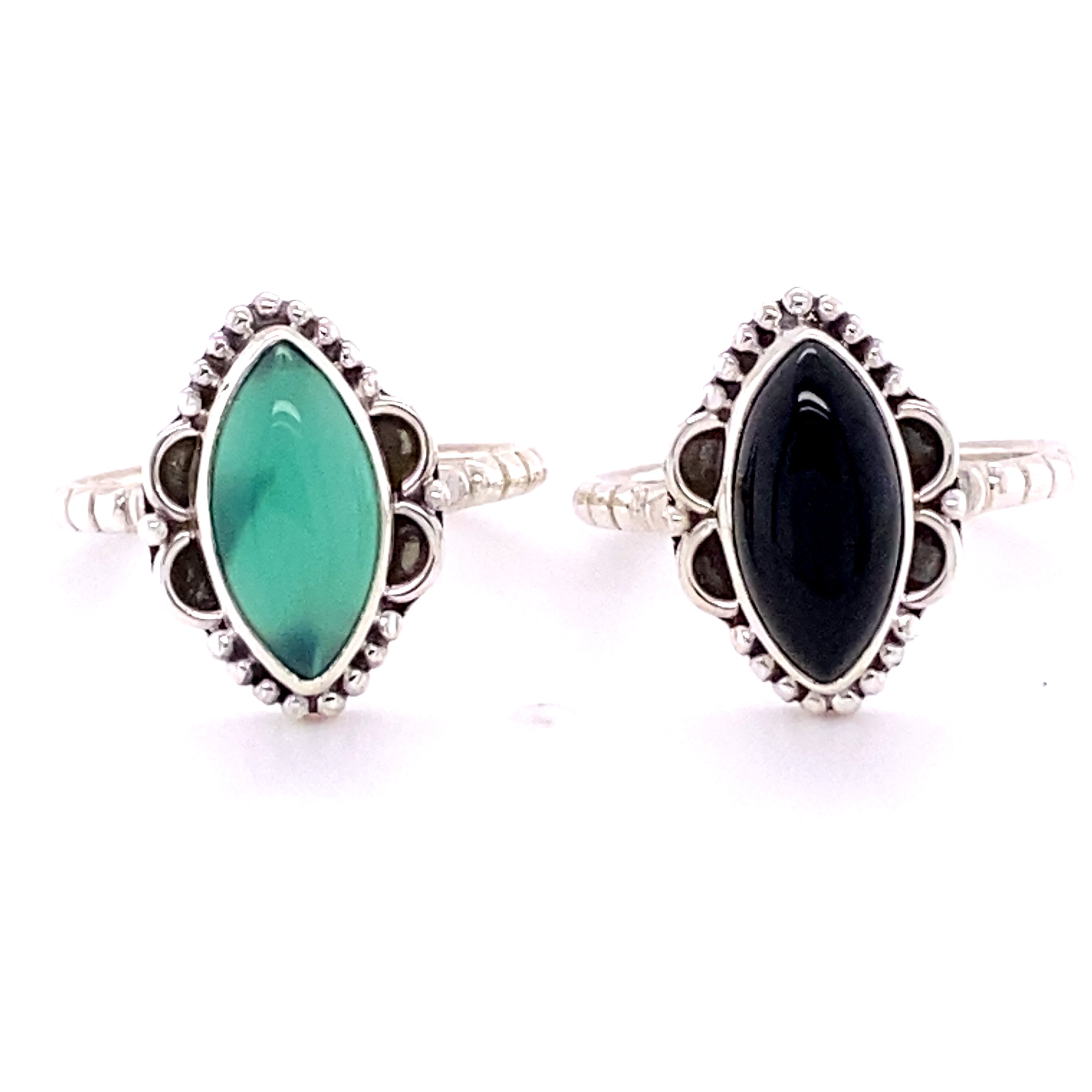 Two Marquise Shaped Gemstone Rings with Ball Border and Textured Band, with black and green cabochon stones.