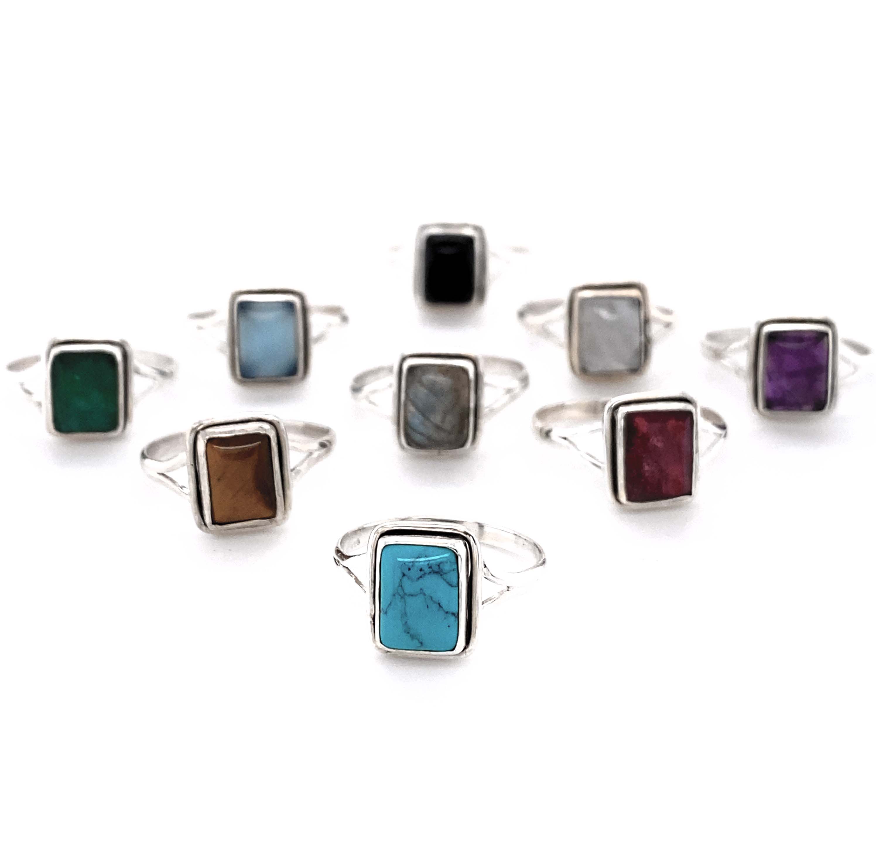 A set of Simple Square Gemstone Rings with stone accents.