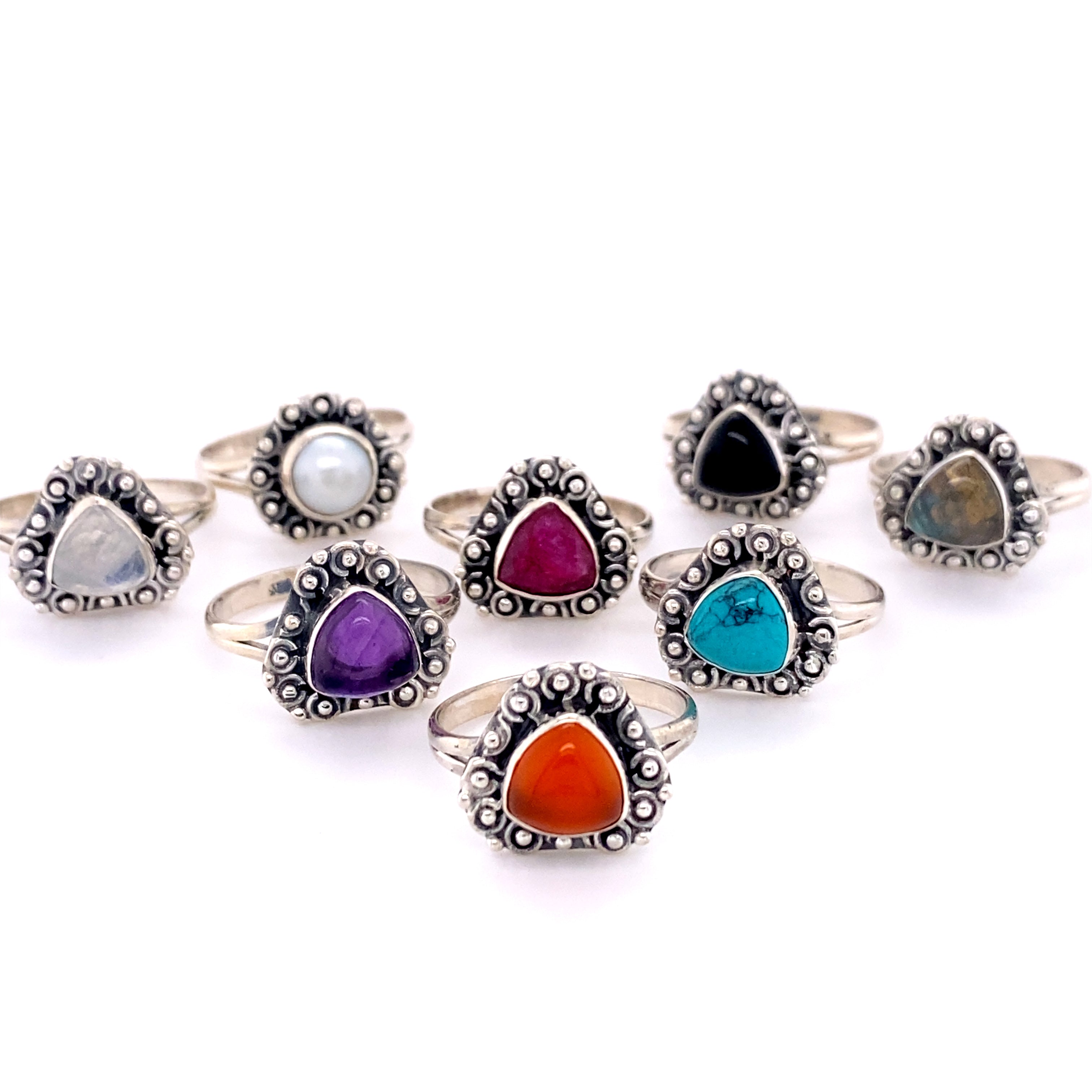 A set of Triangular Gemstone Rings with A Flat Ball Boarder in Santa Cruz.