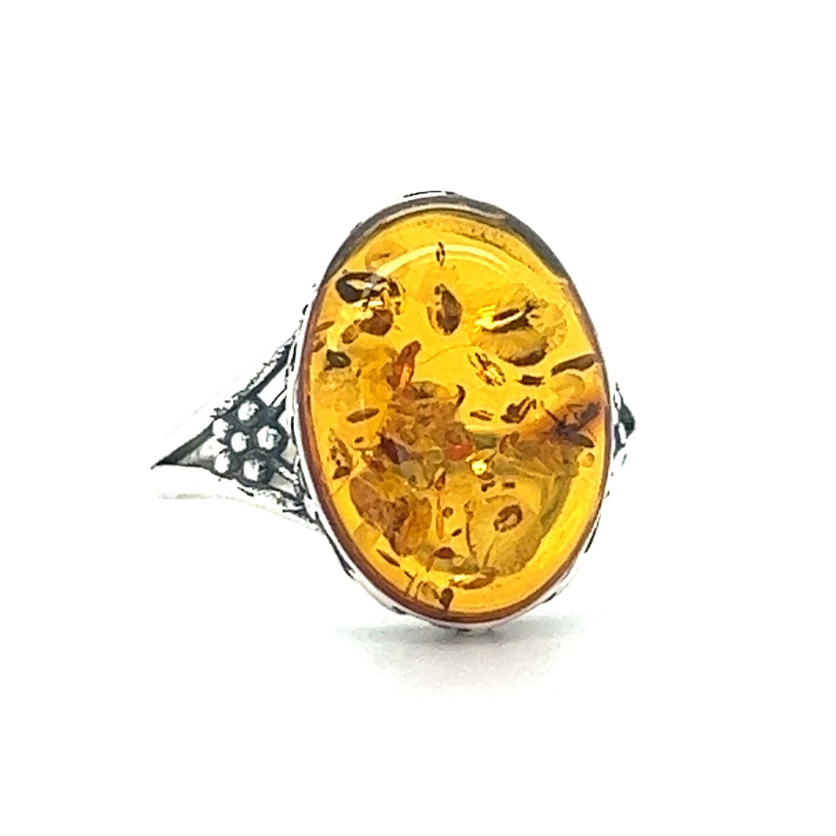 A Super Silver Baltic Amber Ring with Victorian Styled Floral Setting, perfect for everyday style.