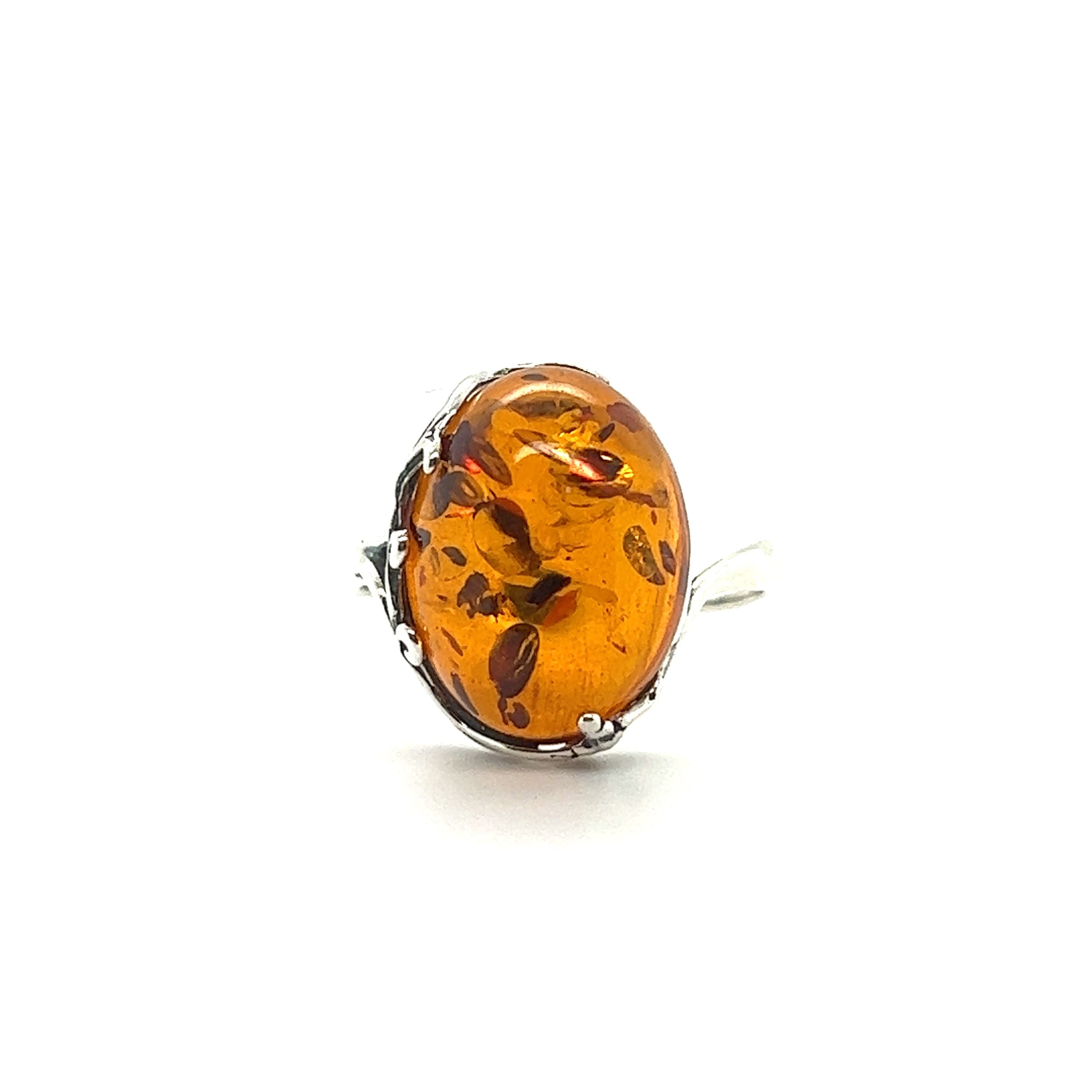 This Stunning Victorian Styled Amber Ring by Super Silver features a Baltic amber stone, showcasing the natural beauty of the earth.
