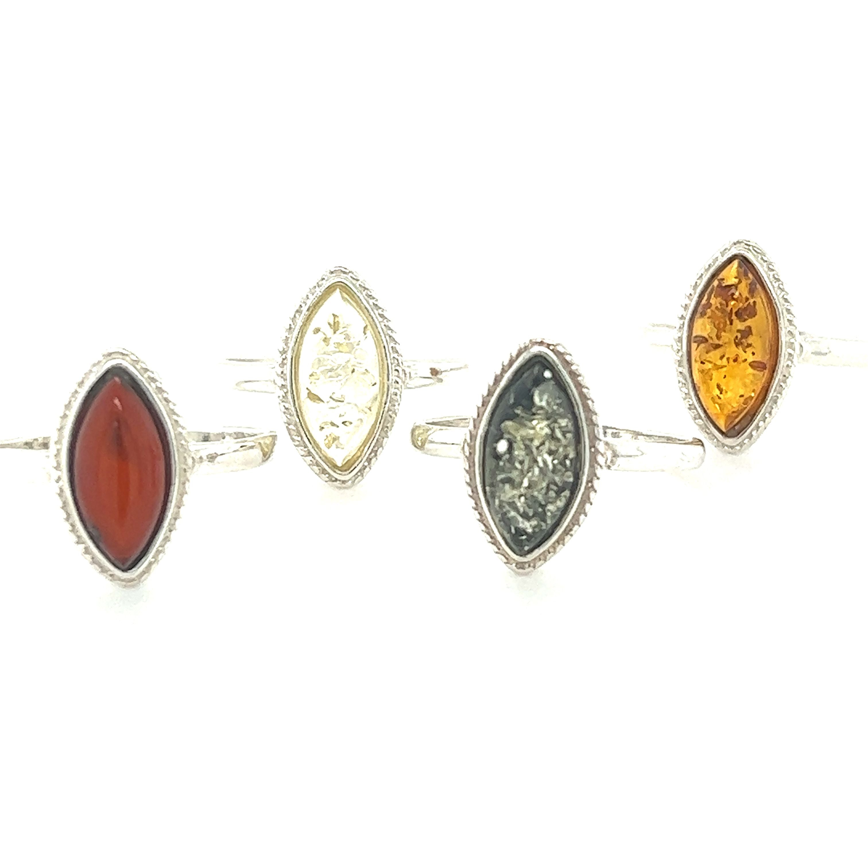 A set of Super Silver Marquise Baltic Amber Rings with Delicate Rope Border.