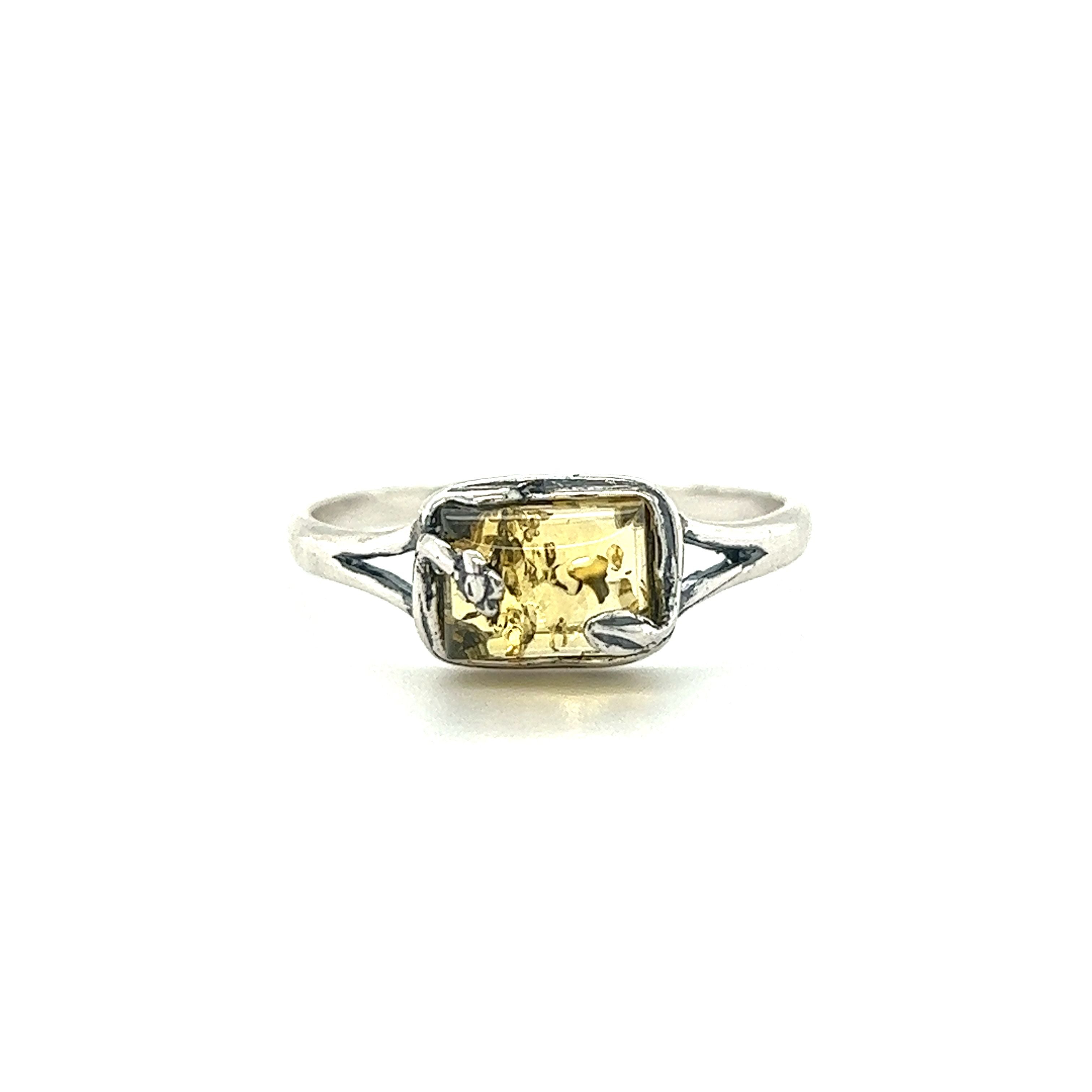 A Rectangle Amber Ring with Nature Detailing from Super Silver.