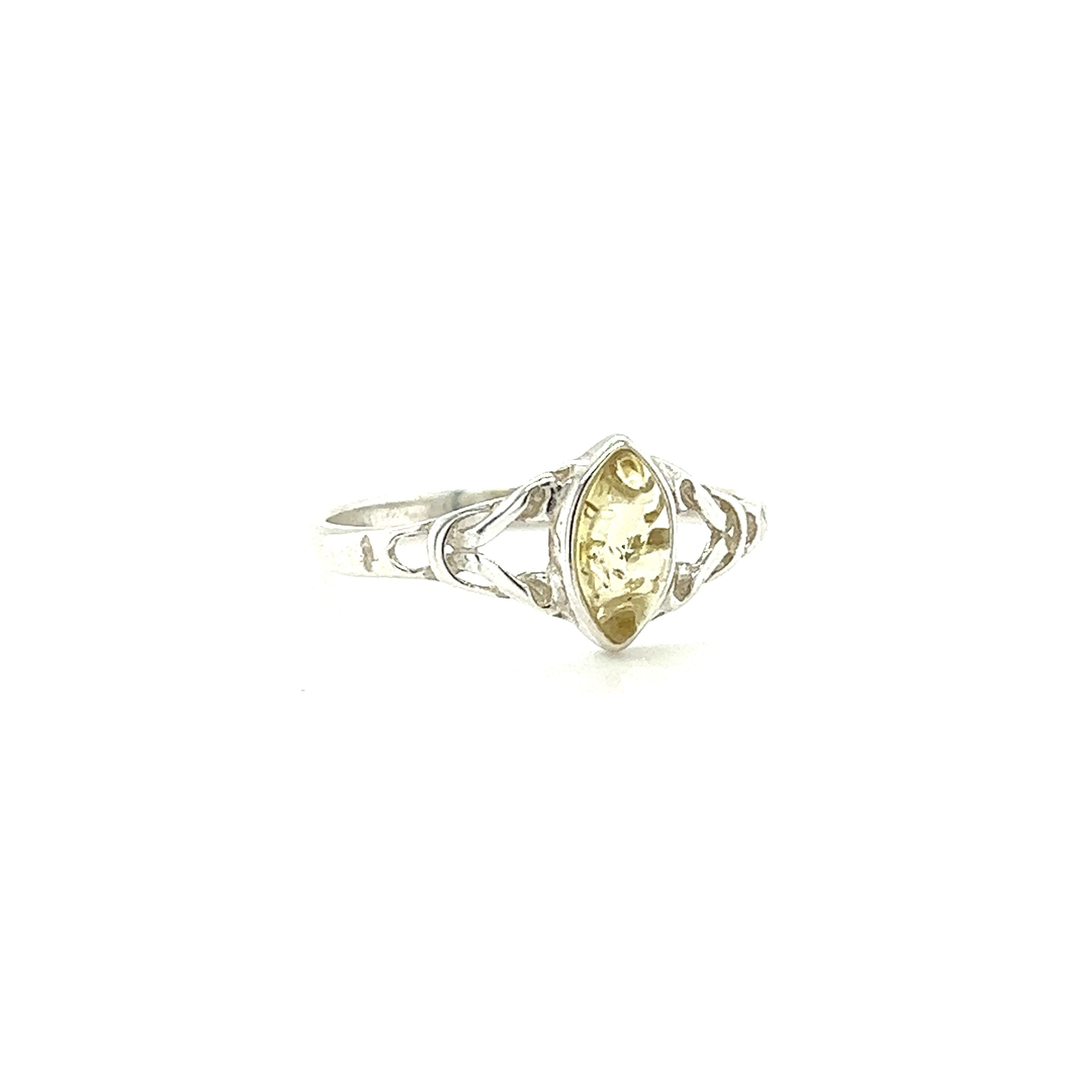 A Delicate Celtic Inspired Amber Ring with an oval citrine stone, perfect for spiritual growth and made with .925 Sterling Silver, by Super Silver.