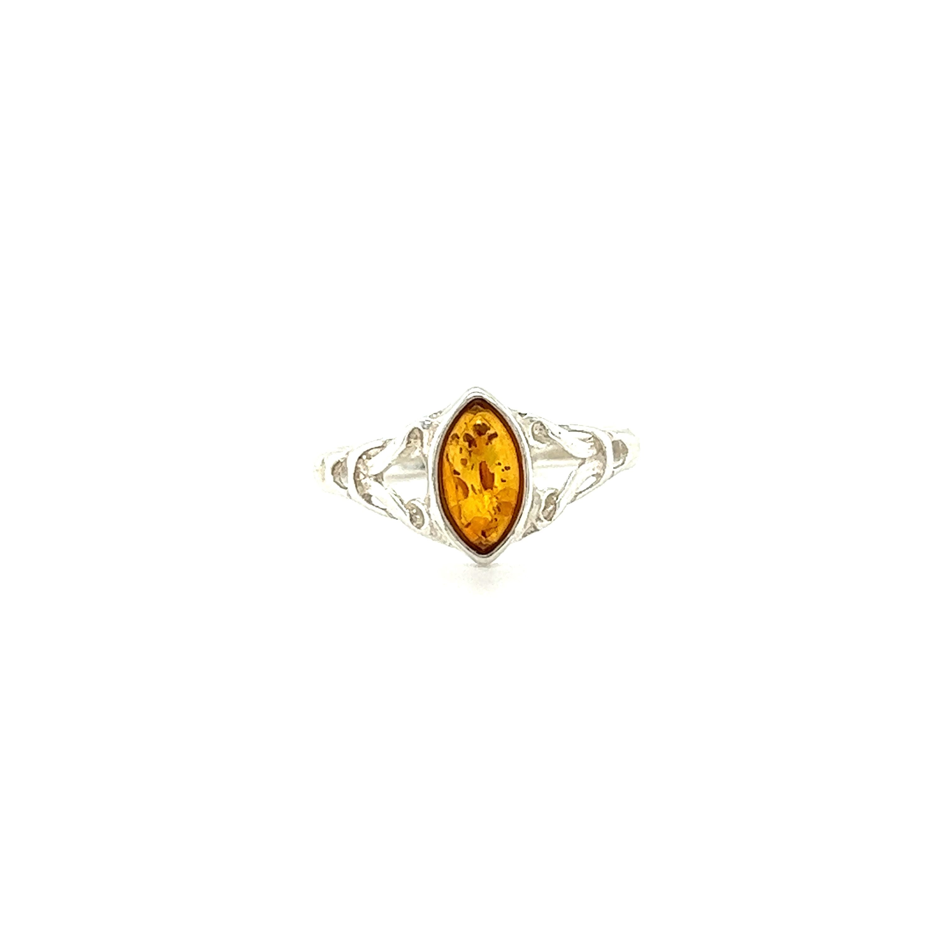 This Super Silver Delicate Celtic Inspired Amber Ring features an oval Baltic amber stone, perfect for those seeking healing and spiritual growth.