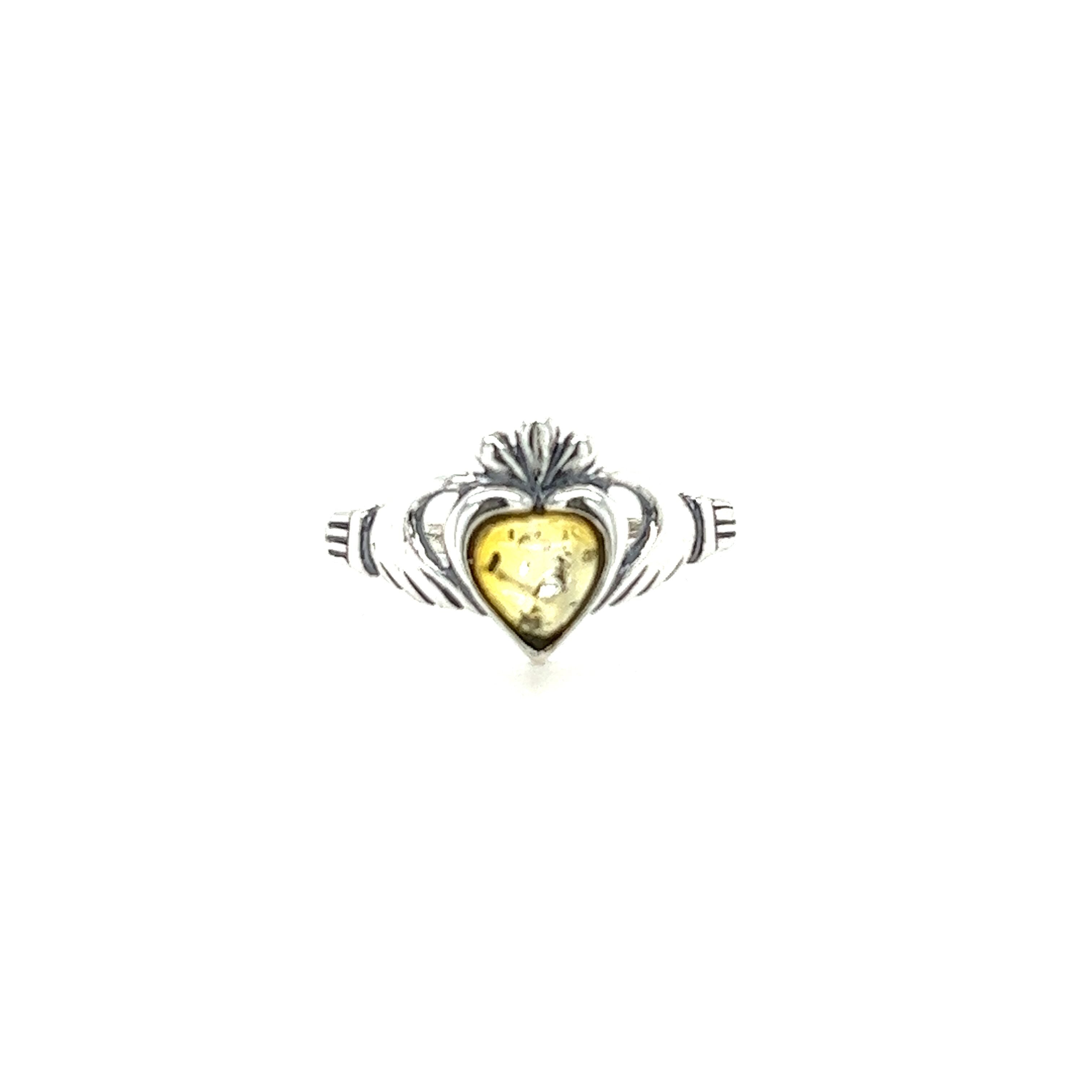 A Super Silver Claddagh Amber Heart Ring with a yellow stone, symbolizing love and friendship. Made of .925 Sterling Silver, featuring a Claddagh Baltic amber ring.