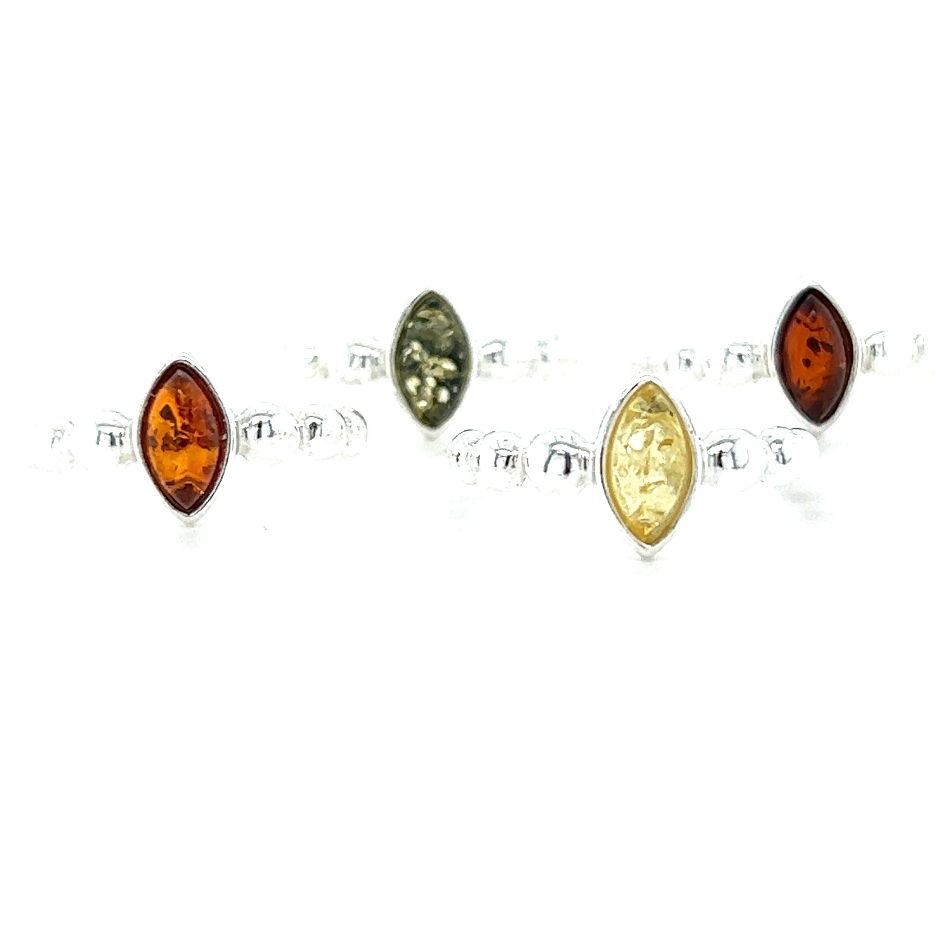 A set of Super Silver's Modern Amber Ring with Half Beaded Band adorned with genuine Baltic amber beads.