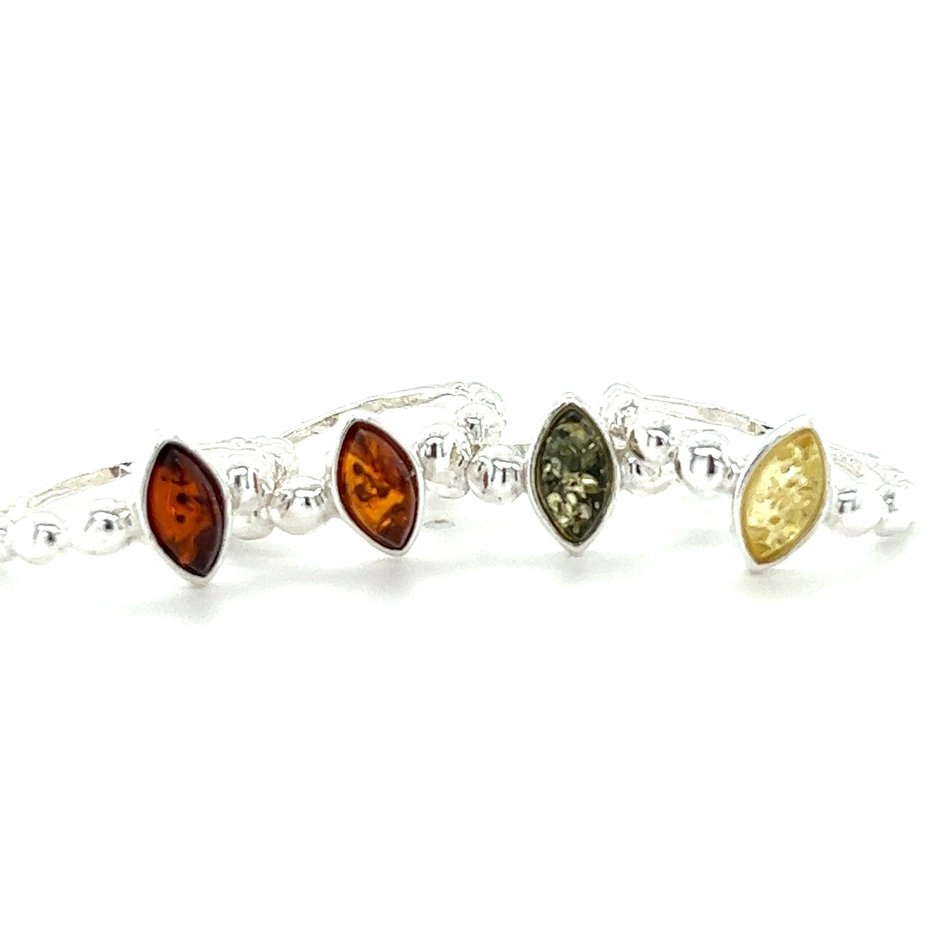 A set of Modern Amber Rings with Half Beaded Bands from Super Silver.