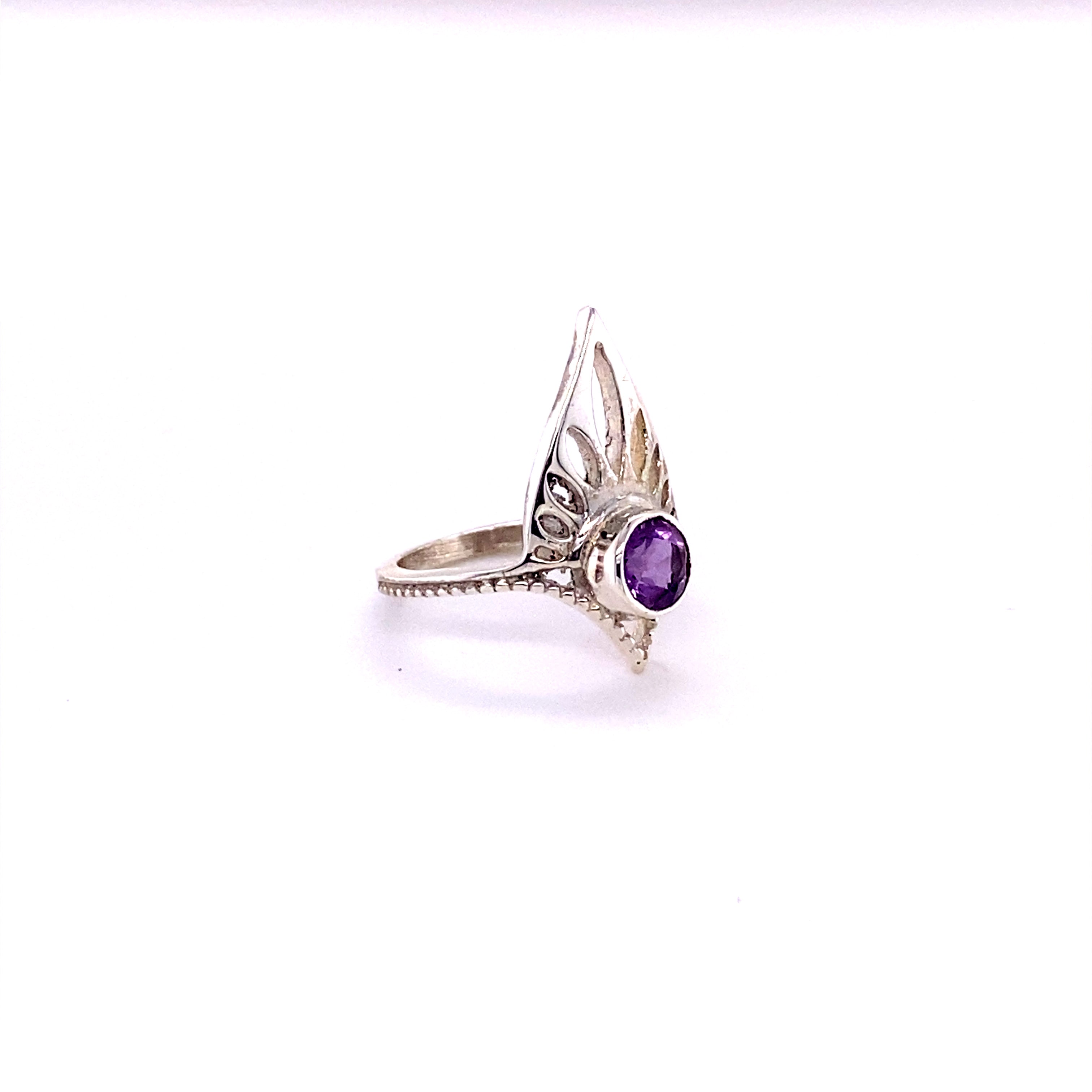 A Henna Shield Ring with Natural Gemstones, a sterling silver amethyst ring with a purple stone.