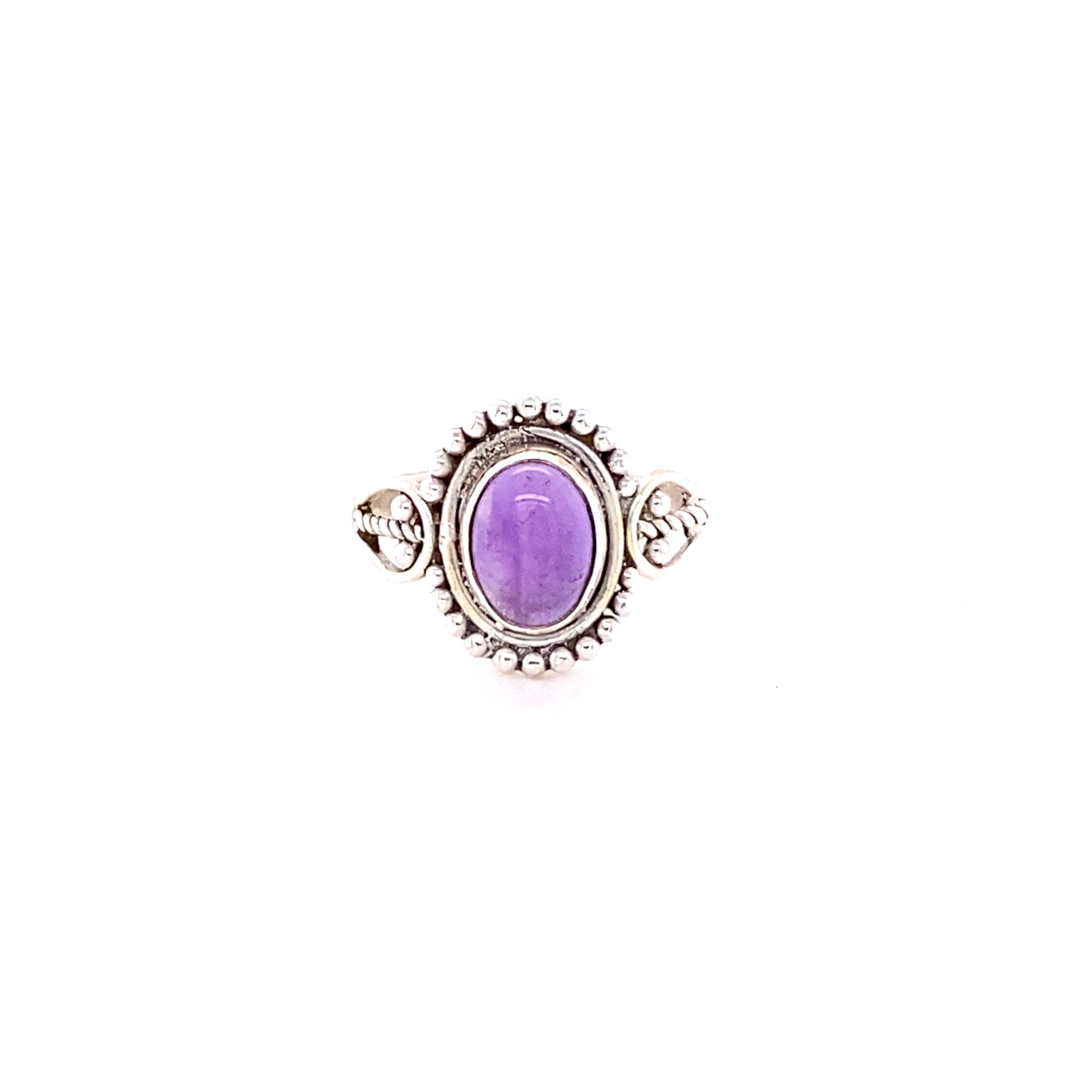 A sterling silver Oval Gemstone with Ball Design ring, set on a white background.