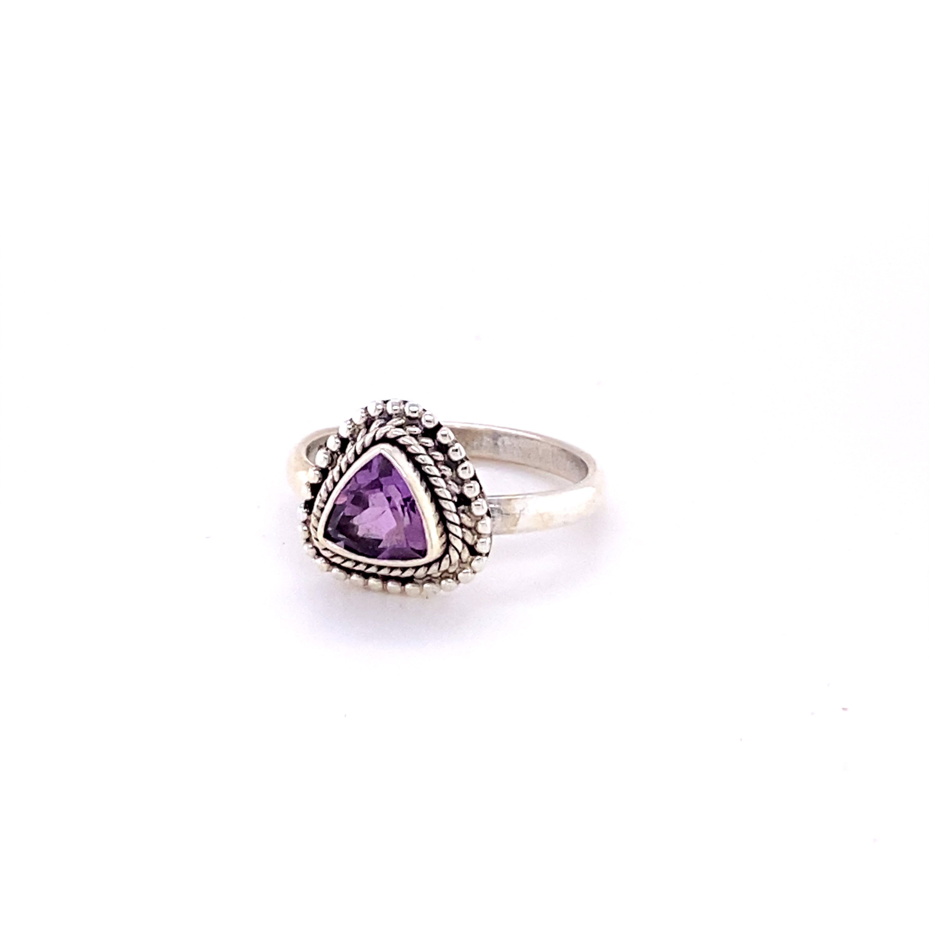 A Triangle Gemstone Ring with Rope Border with a purple amethyst stone.