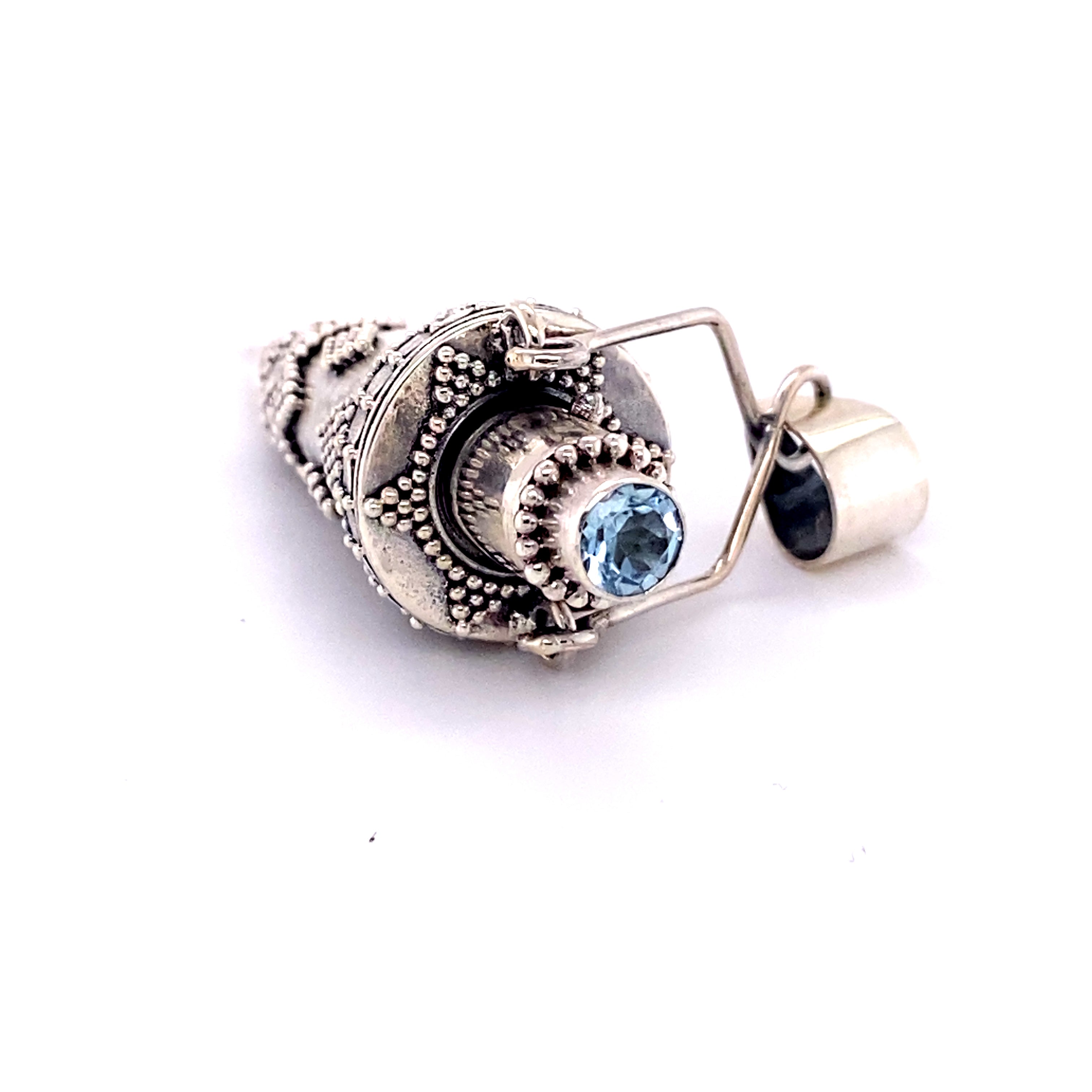 A Super Silver Ornate Stone Poison Pendant with a blue topaz gemstone.