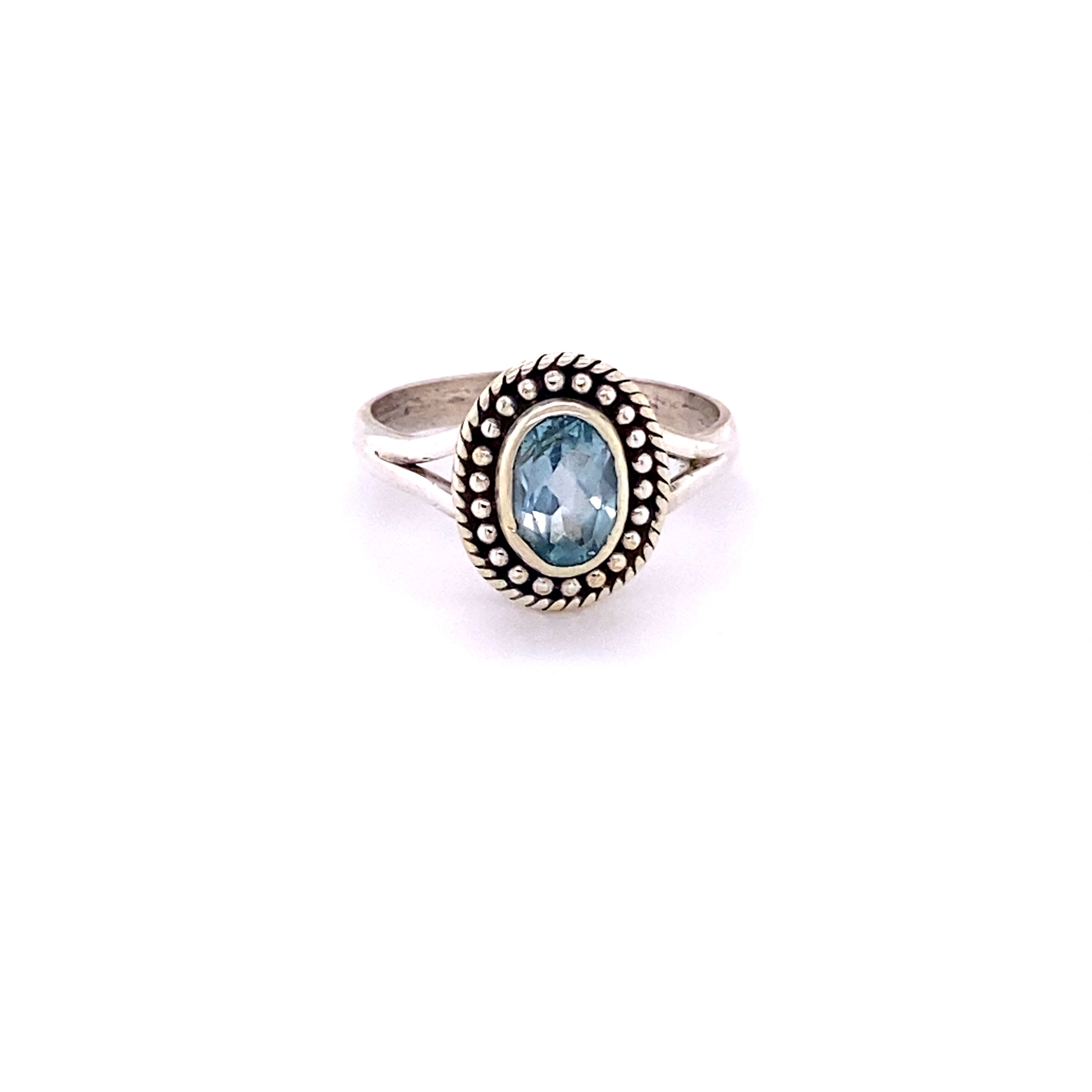 A boho-style Oval Gemstone Ring with Ball Disk Rope Border.