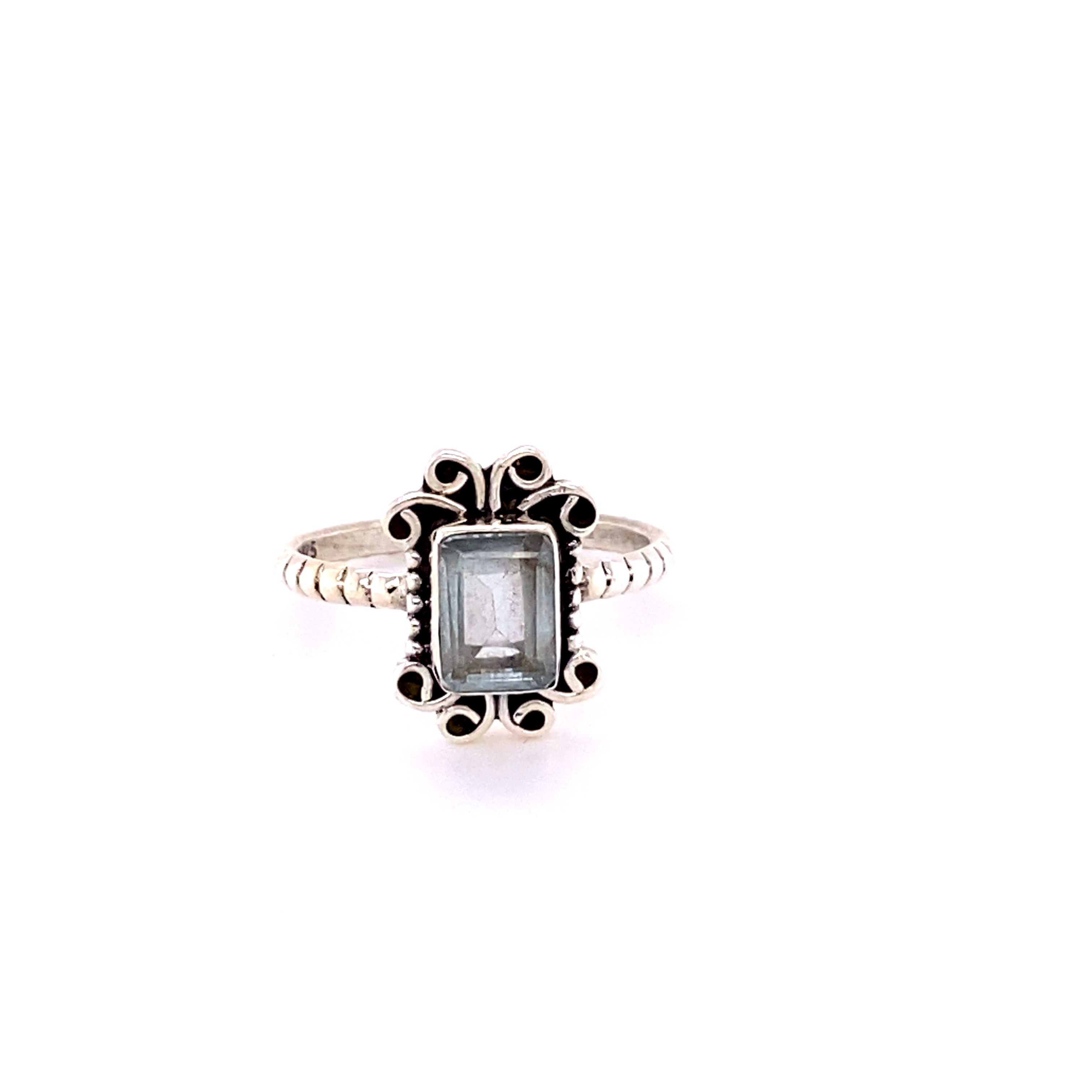 A Natural Gemstone Square Ring with Swirls adorned with a blue topaz stone.
