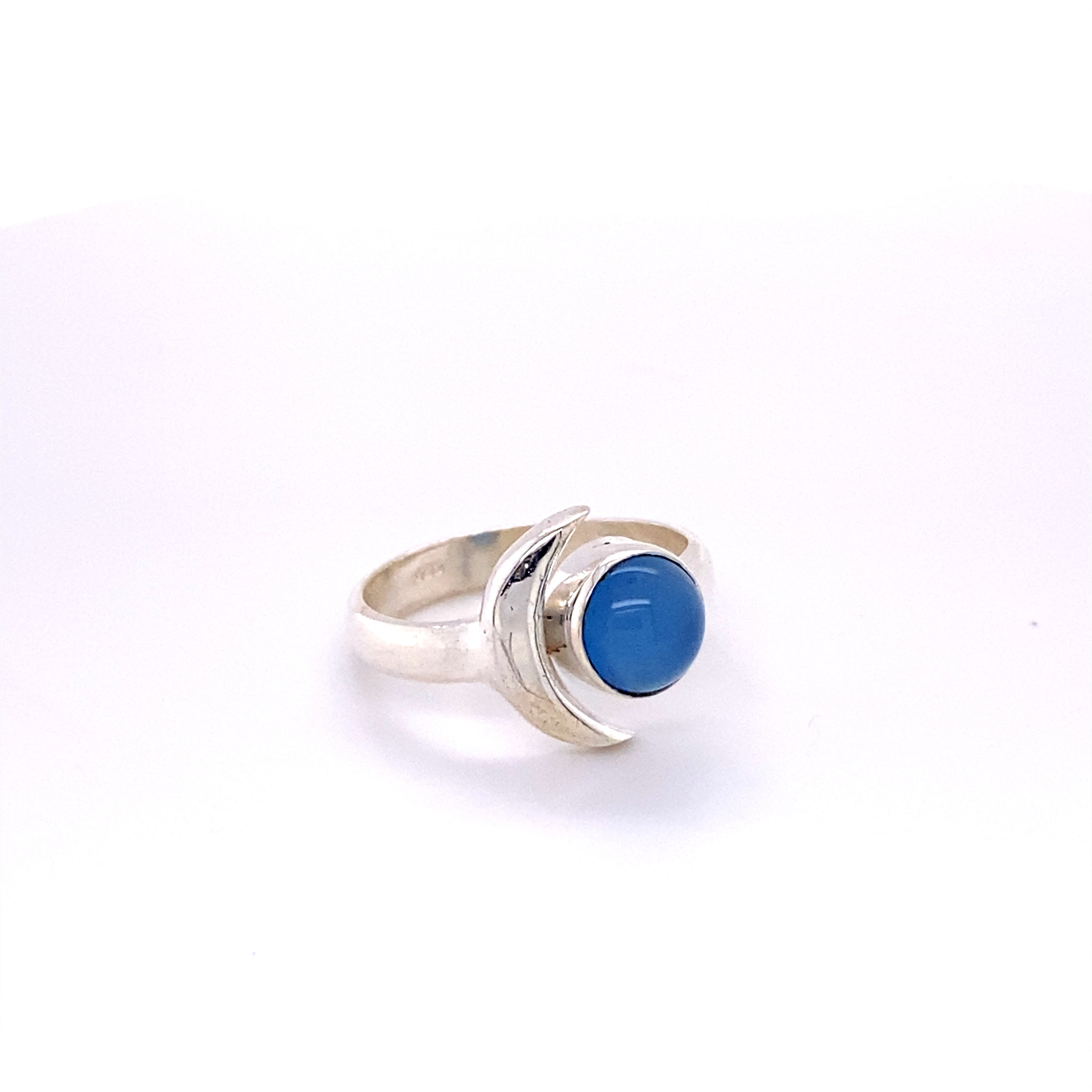 A Crescent Moon Ring with Natural Gemstones adorned with a blue stone.