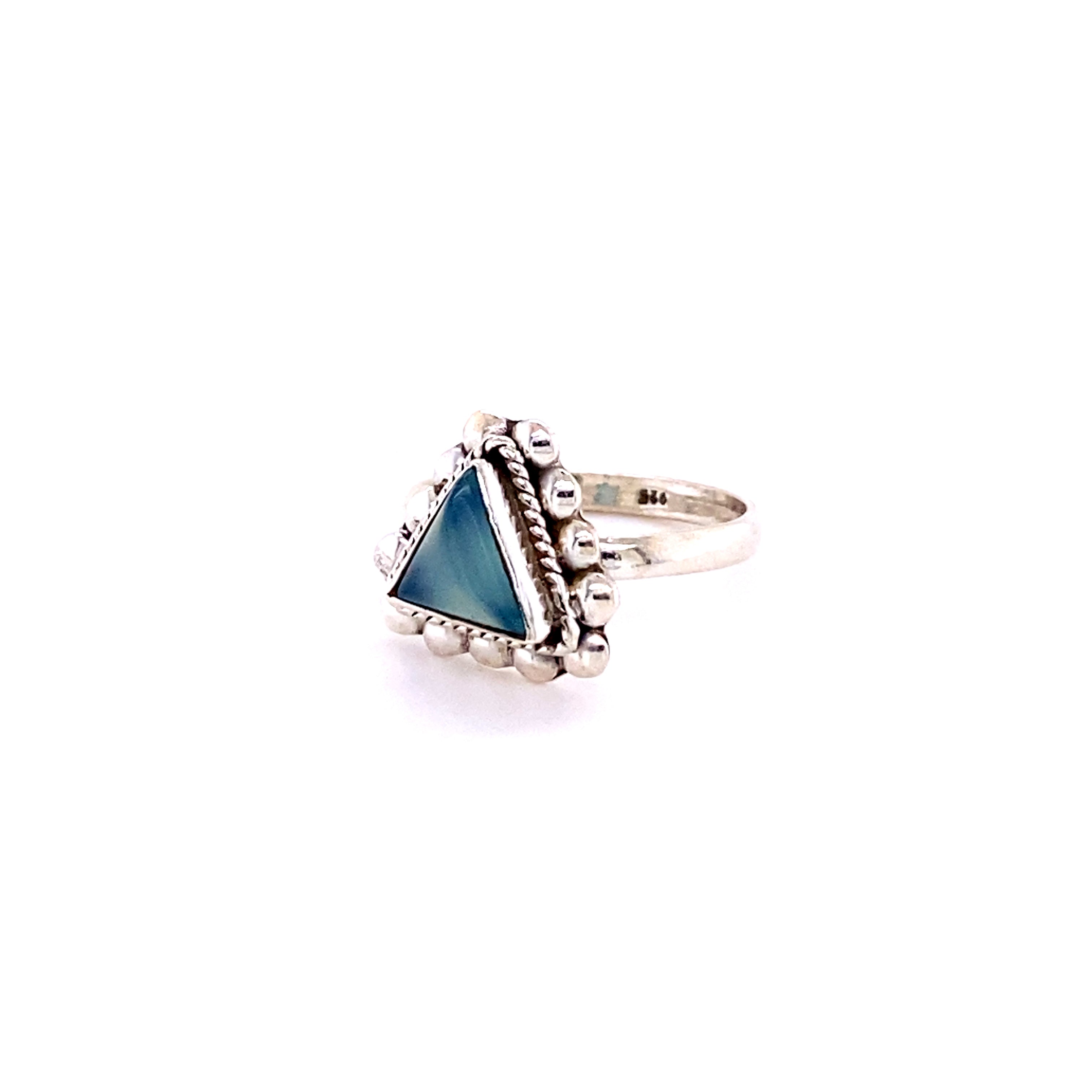 A Triangle Gemstone Ring with Beads with a blue cabochon stone in the middle.