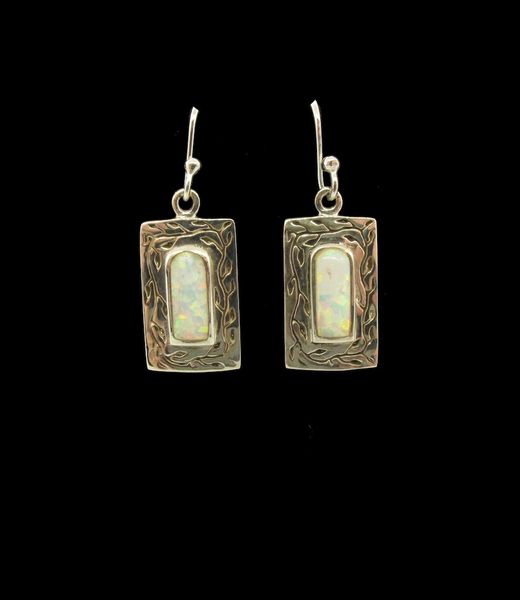 These Super Silver White Created Opal Square Earrings feature stunning white opal, creating an elegant and timeless look.