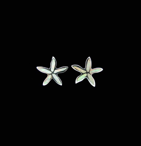A pair of White Created Opal Star Fish Stud Earrings by Super Silver on a black background.