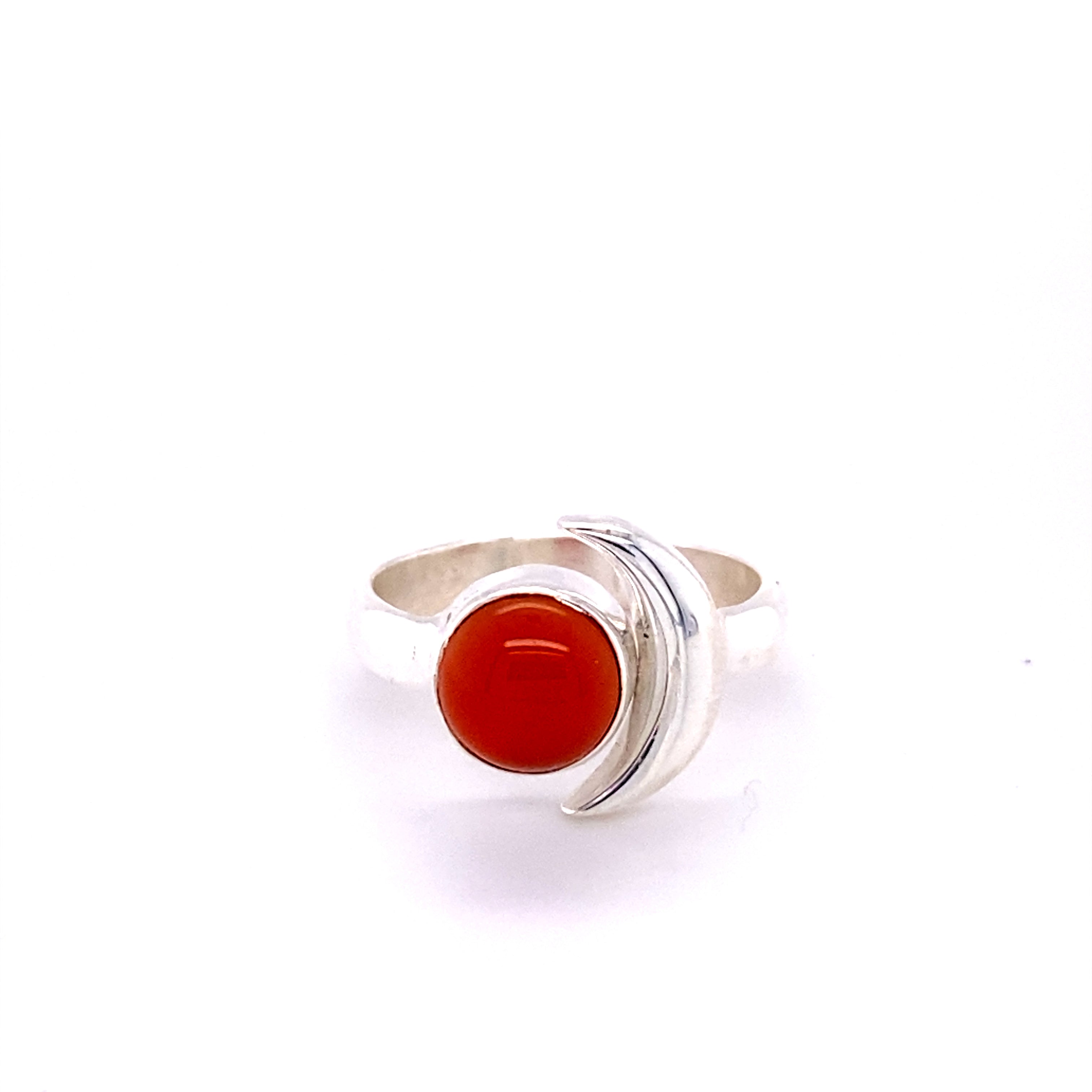A Crescent Moon Ring with Natural Gemstones featuring a red cabochon stone.