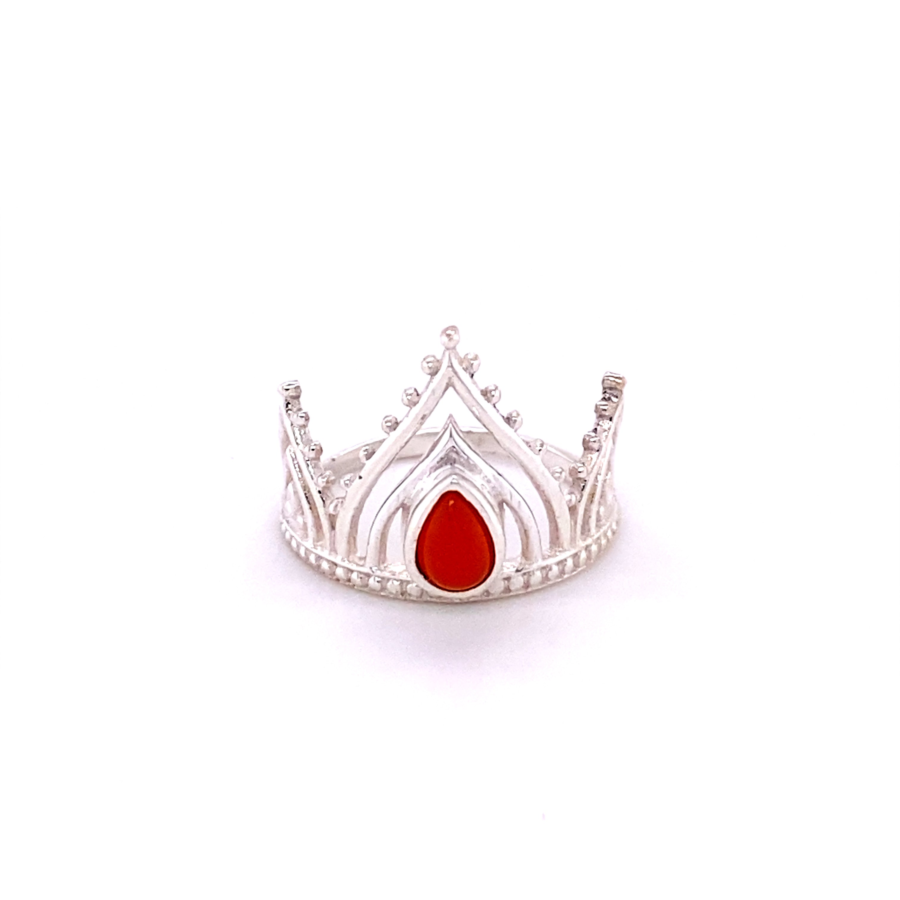 A Henna Crown Ring with Natural Gemstones with a red stone on it.